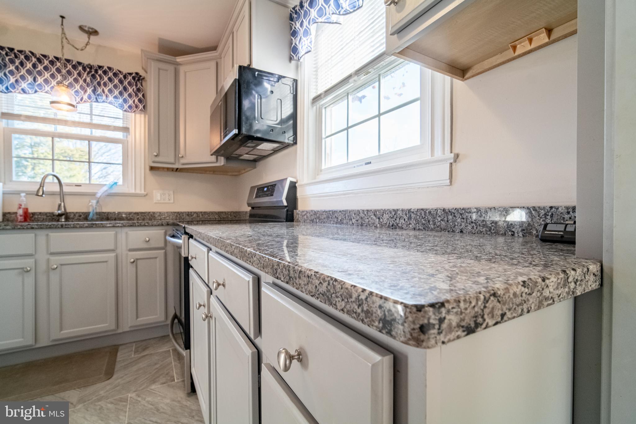 550 East Canal Road York, PA 17404 - Photo 13 of 32 a kitchen with stainless steel appliances granite countertop a sink a stove and cabinets