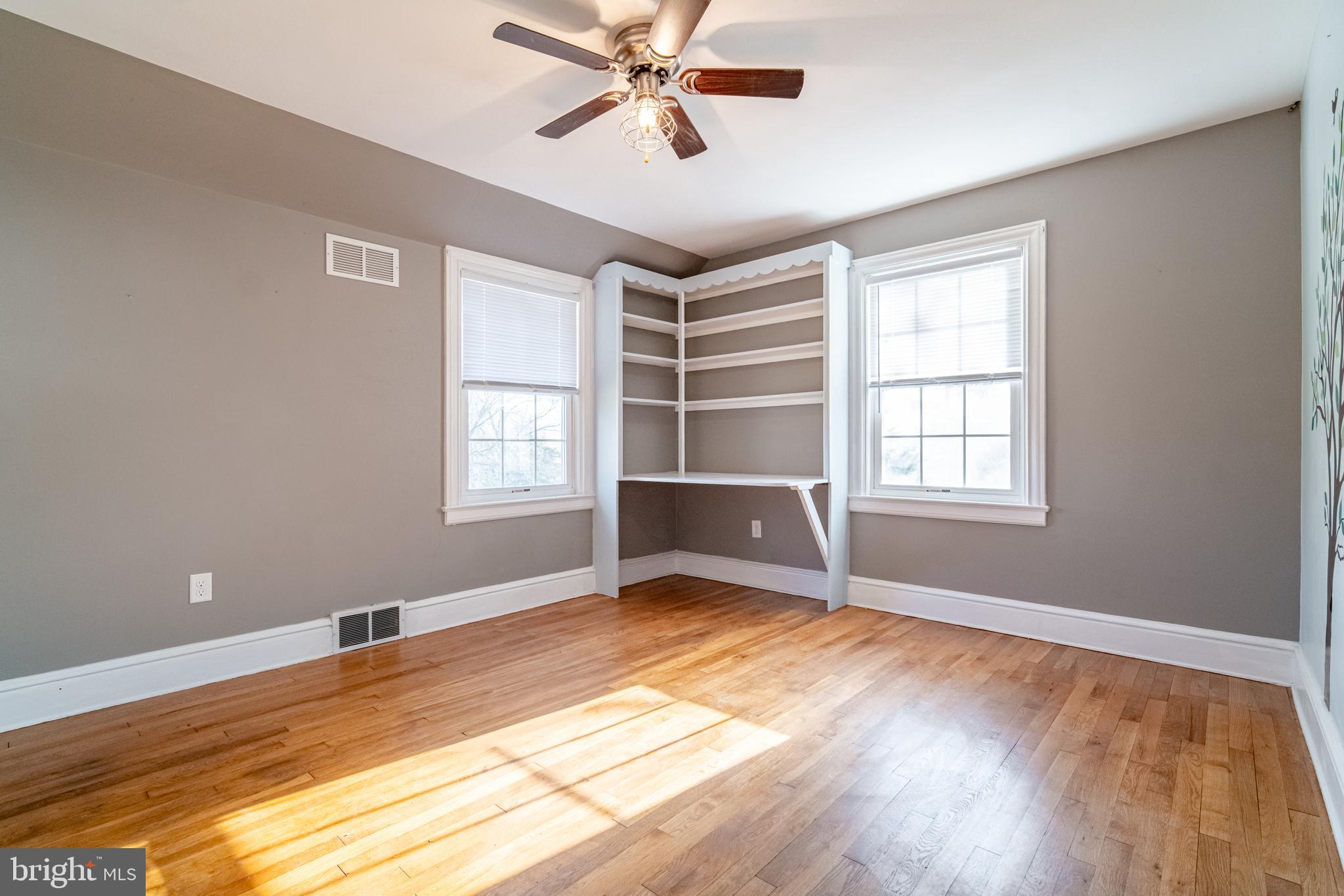 550 East Canal Road York, PA 17404 - Photo 19 of 32 a view of an empty room with a window and wooden floor