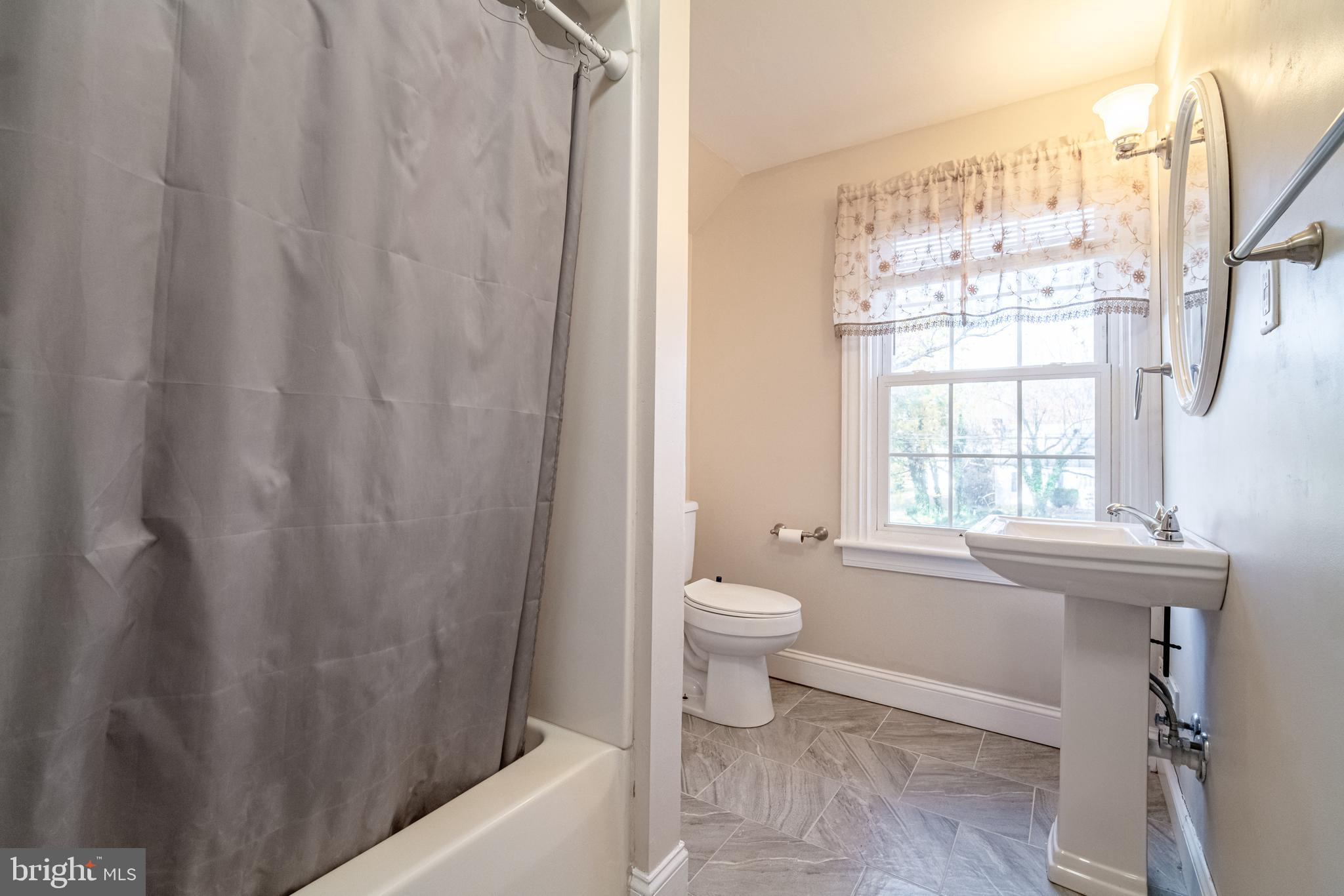 550 East Canal Road York, PA 17404 - Photo 20 of 32 a bathroom with a toilet a sink and a window