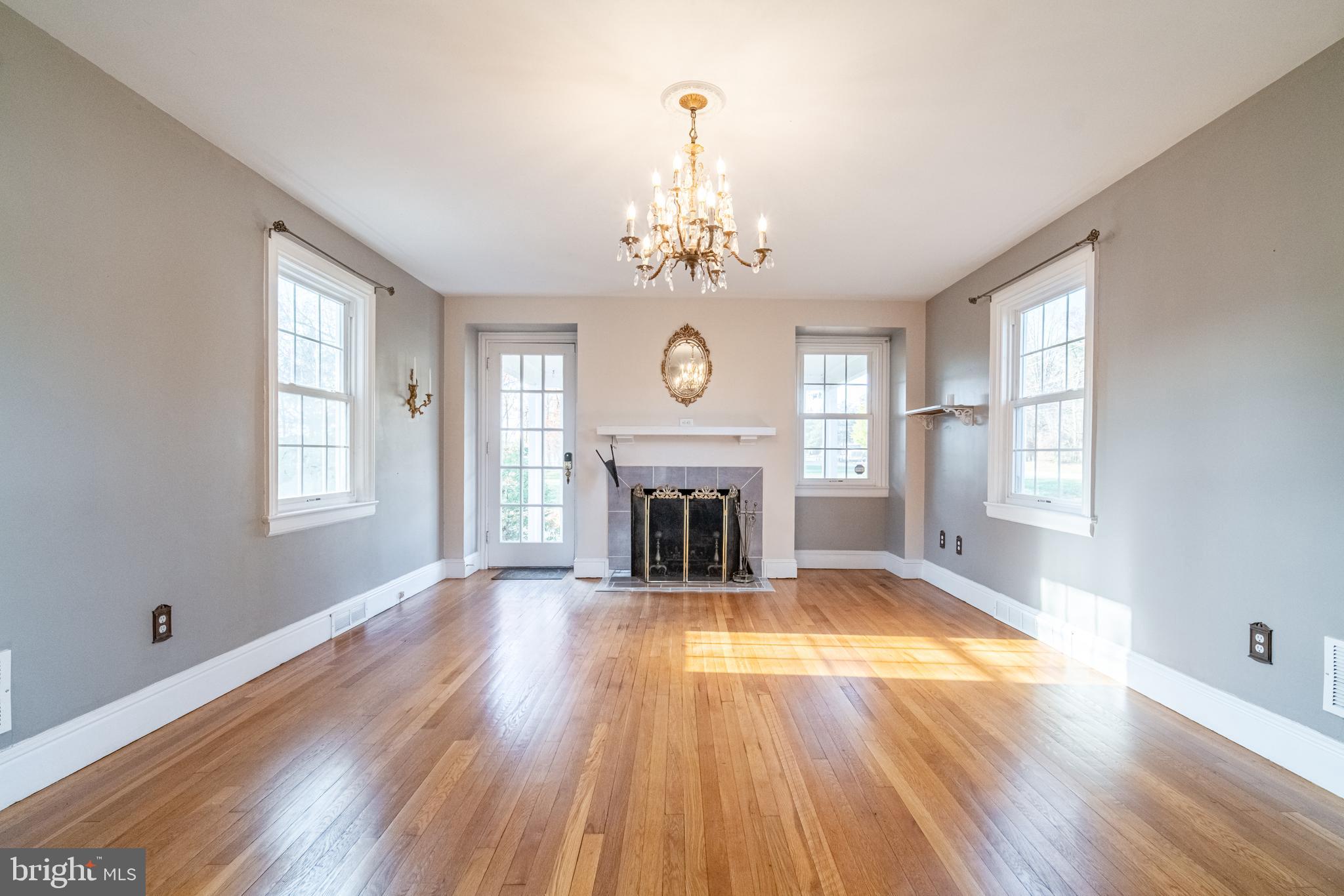 550 East Canal Road York, PA 17404 - Photo 6 of 32 a view of an empty room with wooden floor fireplace and a window