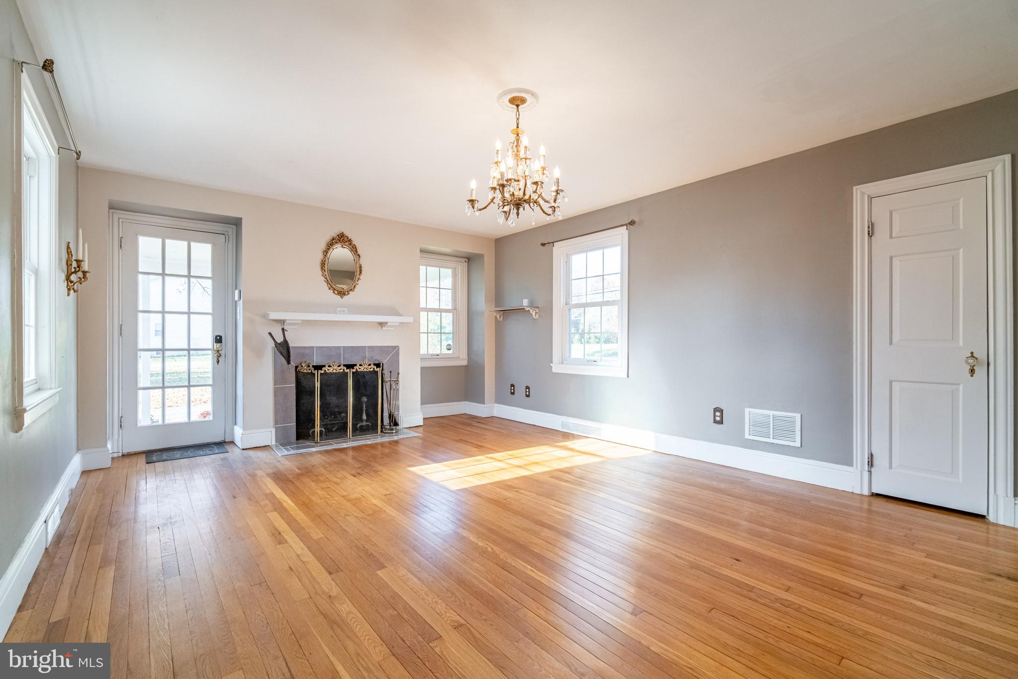 550 East Canal Road York, PA 17404 - Photo 7 of 32 wooden floor fireplace and windows in an empty room