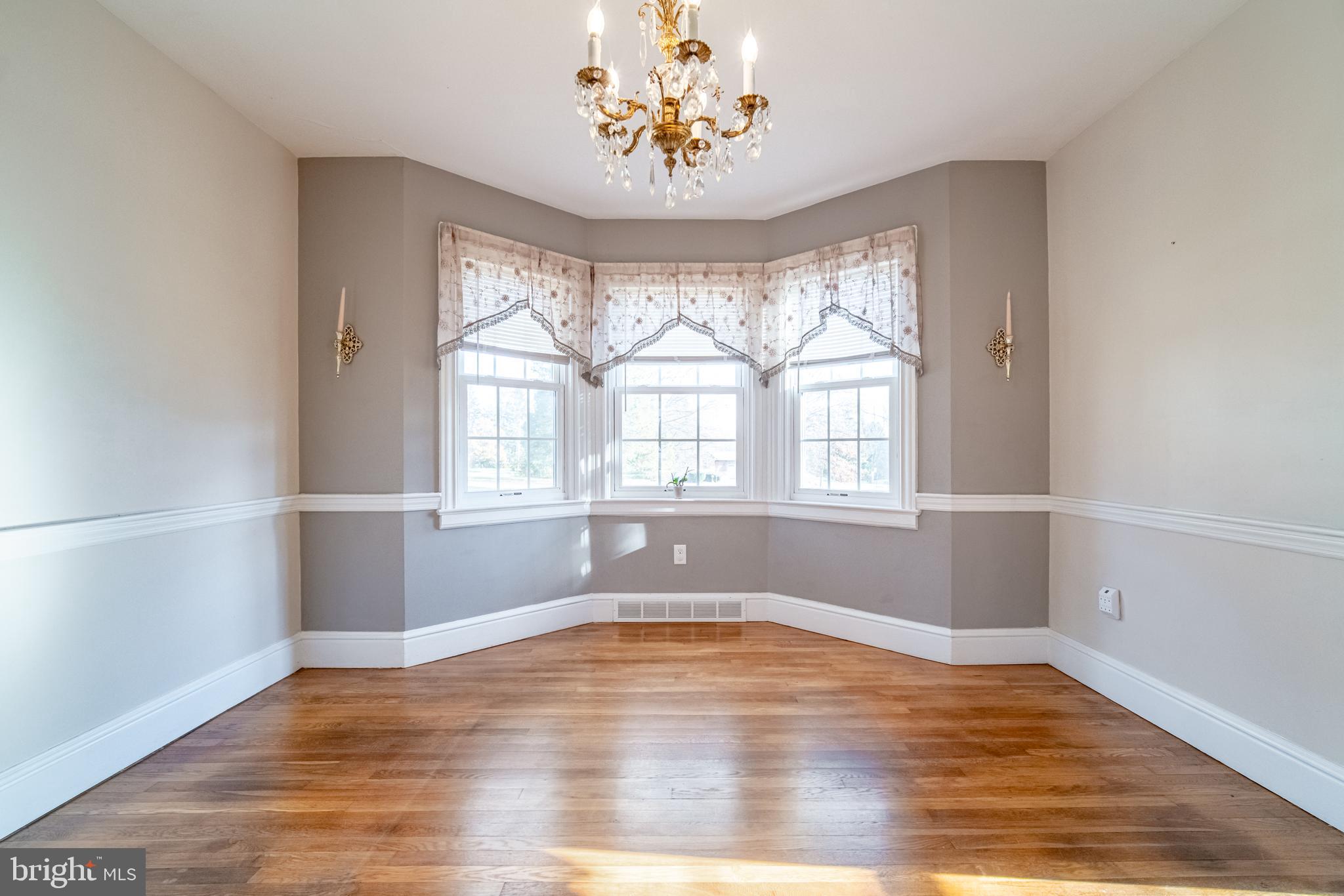 550 East Canal Road York, PA 17404 - Photo 9 of 32 an empty room with wooden floor and windows