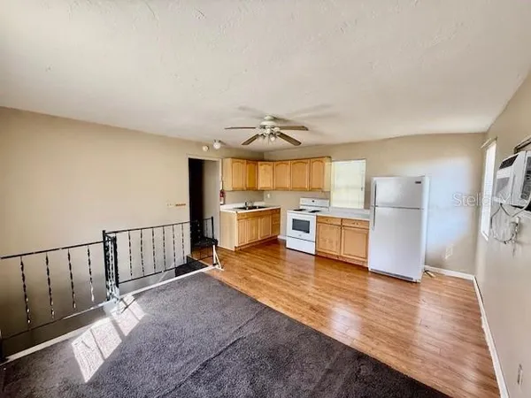 a view of kitchen with wooden floor