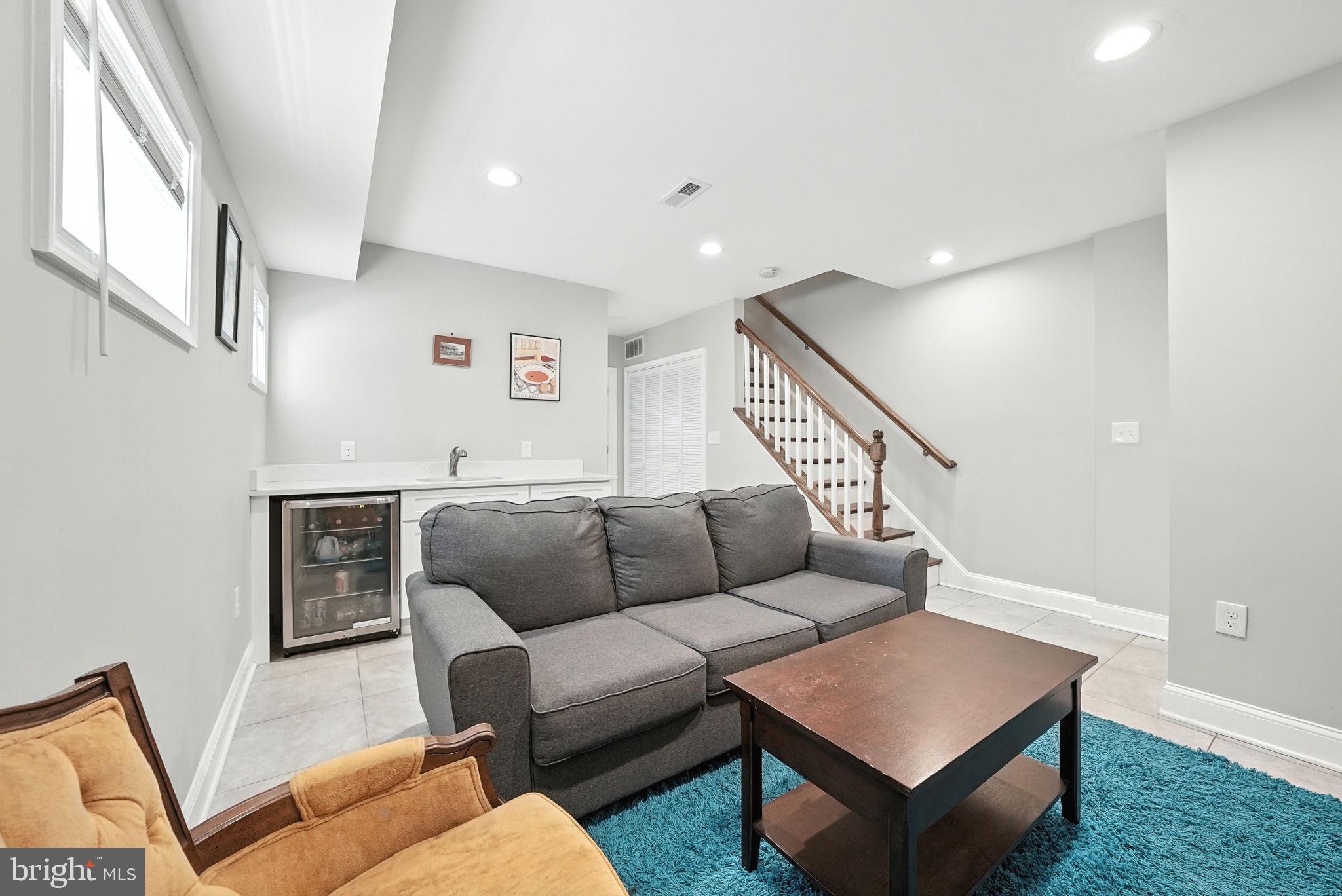 835 Oglethorpe Street Northeast Washington, DC 20011 - Photo 14 of 22 a living room with furniture and a wooden floor