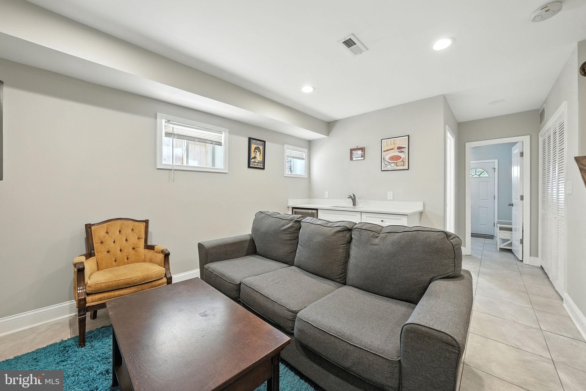 835 Oglethorpe Street Northeast Washington, DC 20011 - Photo 15 of 22 a living room with furniture and a couch