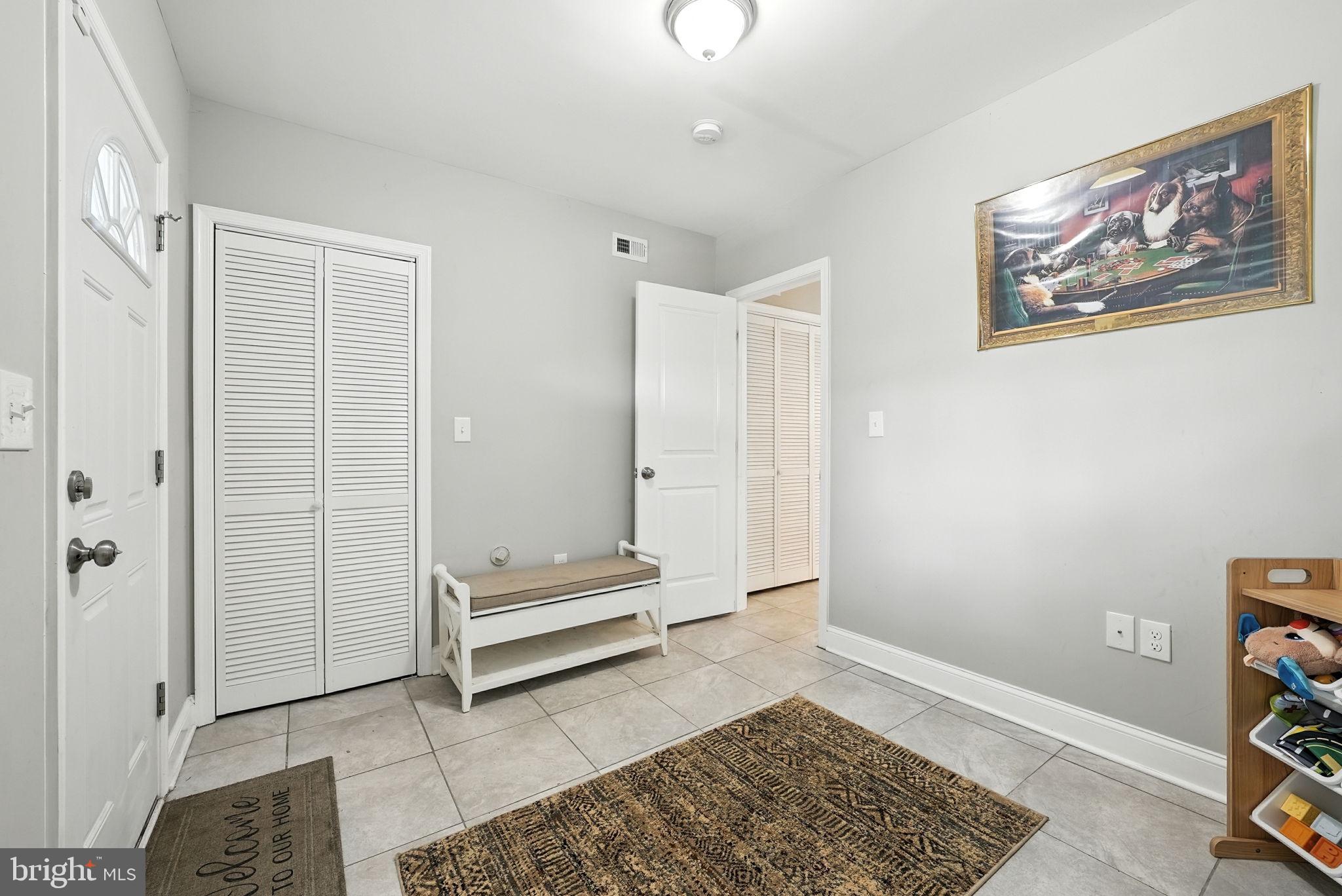 835 Oglethorpe Street Northeast Washington, DC 20011 - Photo 19 of 22 a view of room with stairs and a rug