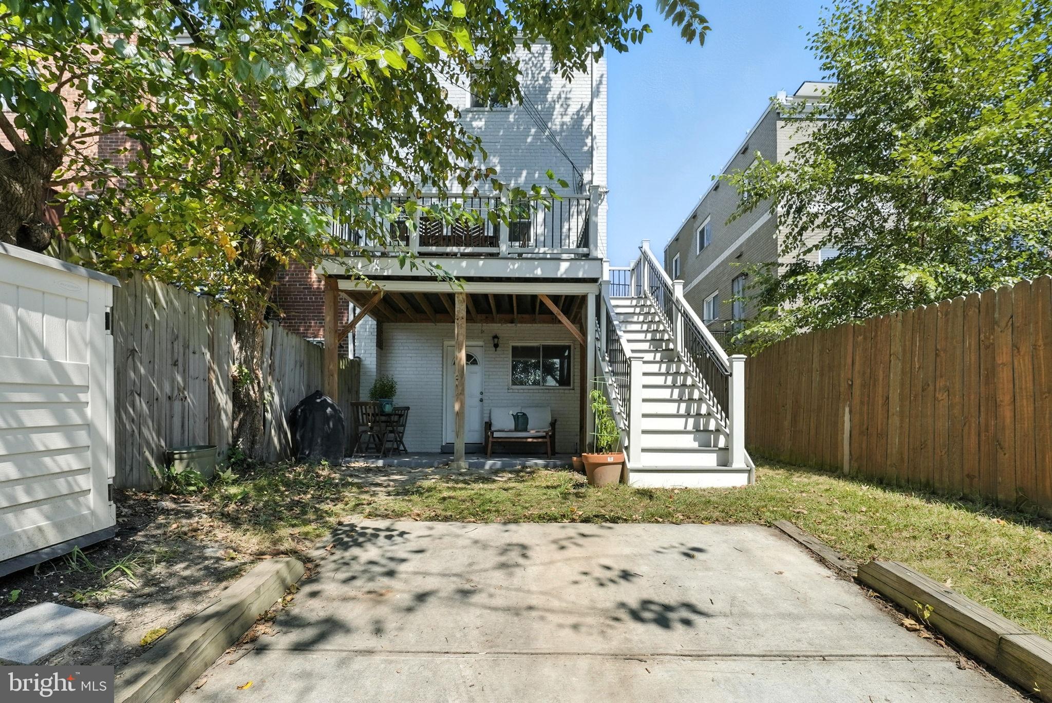 835 Oglethorpe Street Northeast Washington, DC 20011 - Photo 20 of 22 a front view of a house with a yard