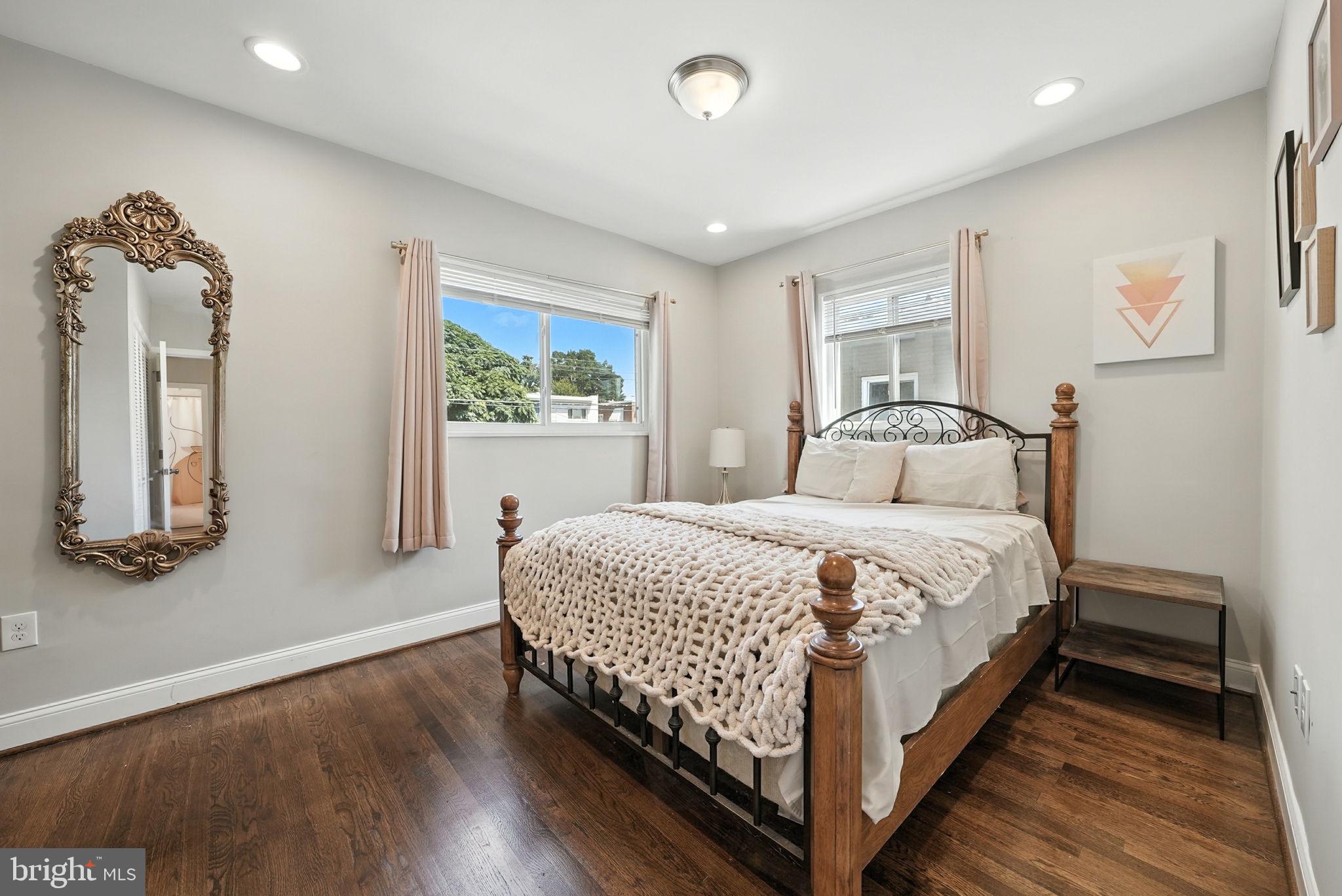 835 Oglethorpe Street Northeast Washington, DC 20011 - Photo 3 of 22 a bedroom with a bed and a dresser