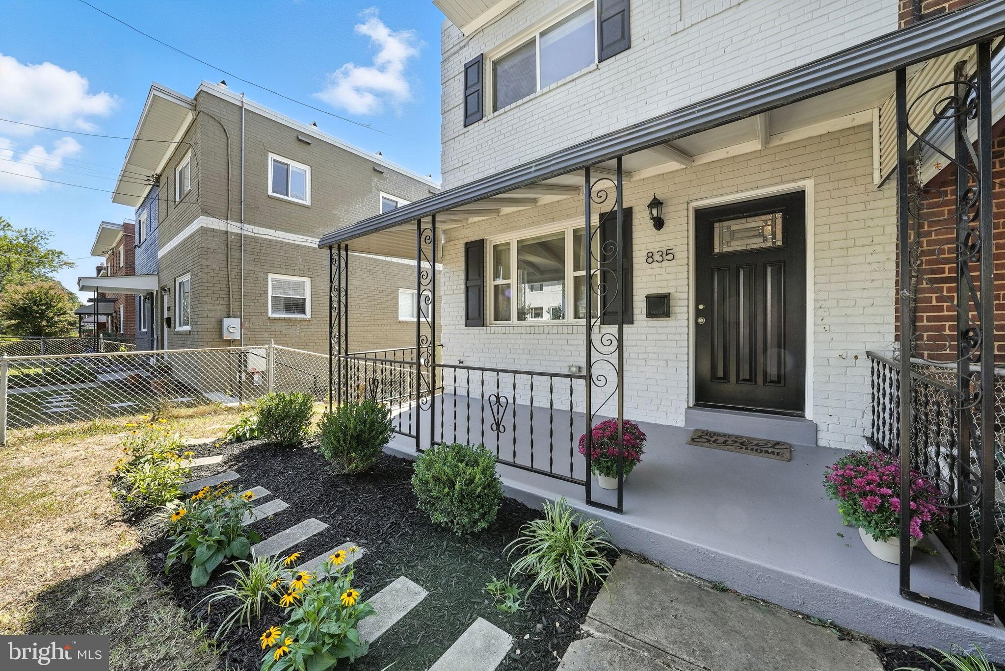 835 Oglethorpe Street Northeast Washington, DC 20011 - Photo 4 of 22 a front view of a house with a yard