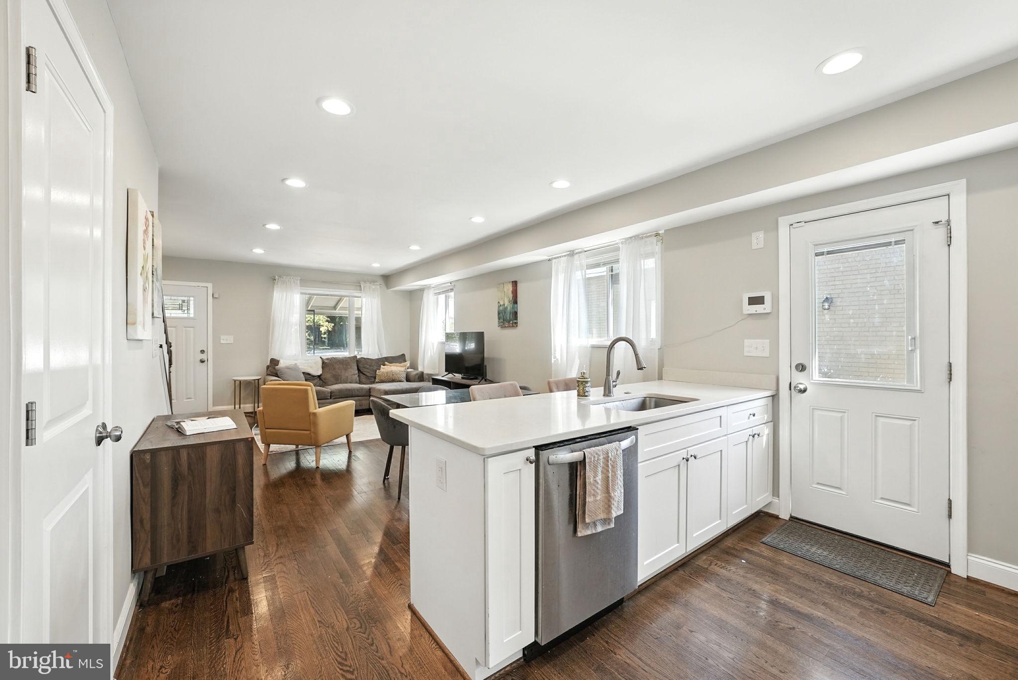 835 Oglethorpe Street Northeast Washington, DC 20011 - Photo 6 of 22 a large white kitchen with a large window
