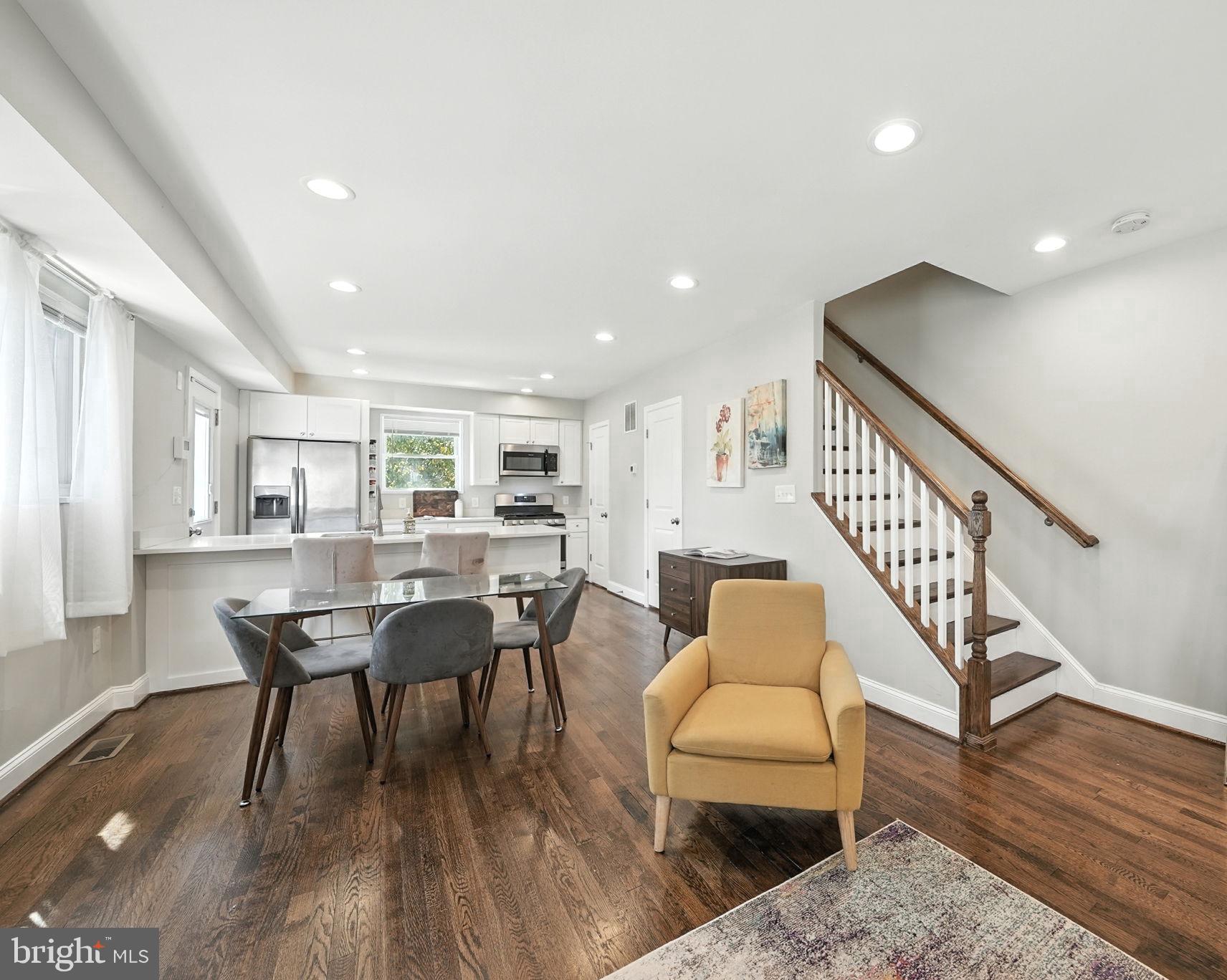835 Oglethorpe Street Northeast Washington, DC 20011 - Photo 8 of 22 a dining room with furniture and wooden floor