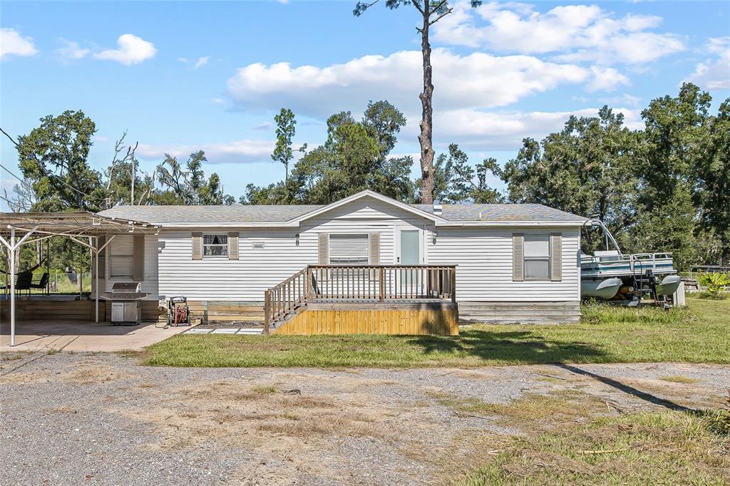 5310 Greenfield Road Lakeland, FL 33810 - Photo 1 of 1 a front view of a house with garden