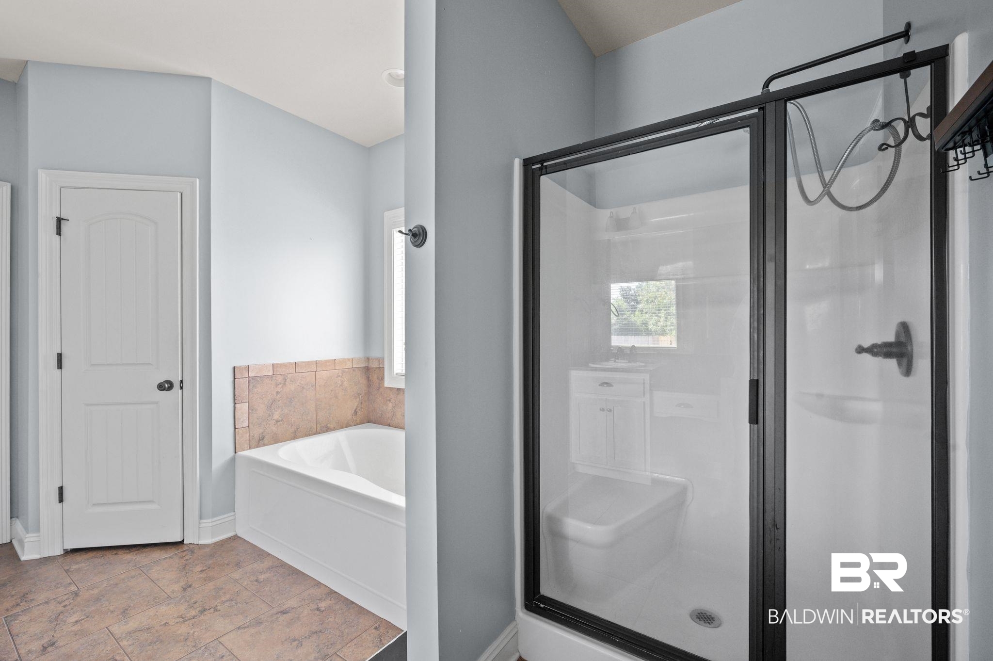 3879 Symphony Way West Semmes, AL 36575 - Photo 19 of 34 Bathroom featuring tile patterned floors and independent shower and bath