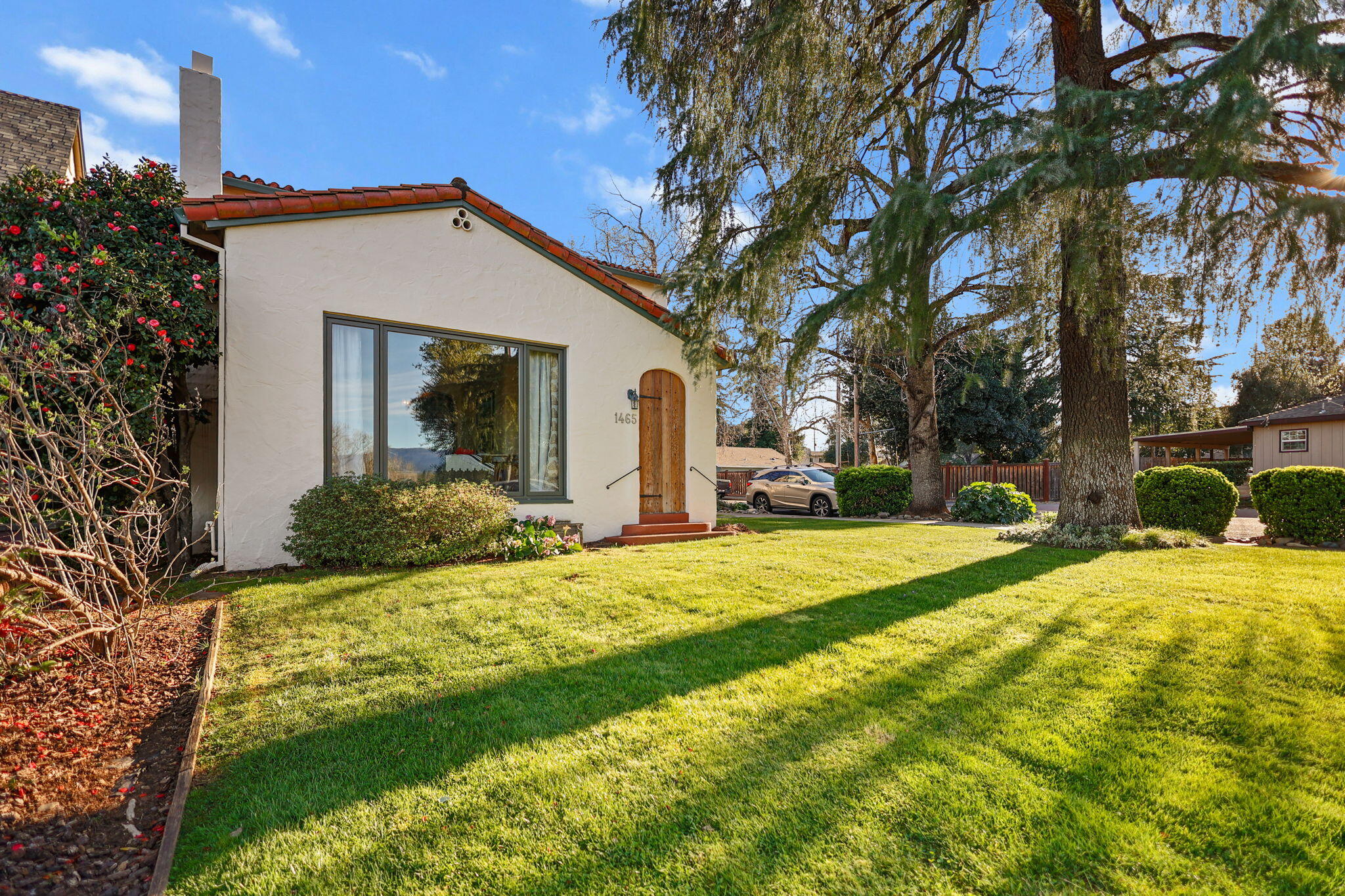 1465 Riverside Drive Redding, CA 96001 - Photo 149 of 163 a view of a house with backyard and tree