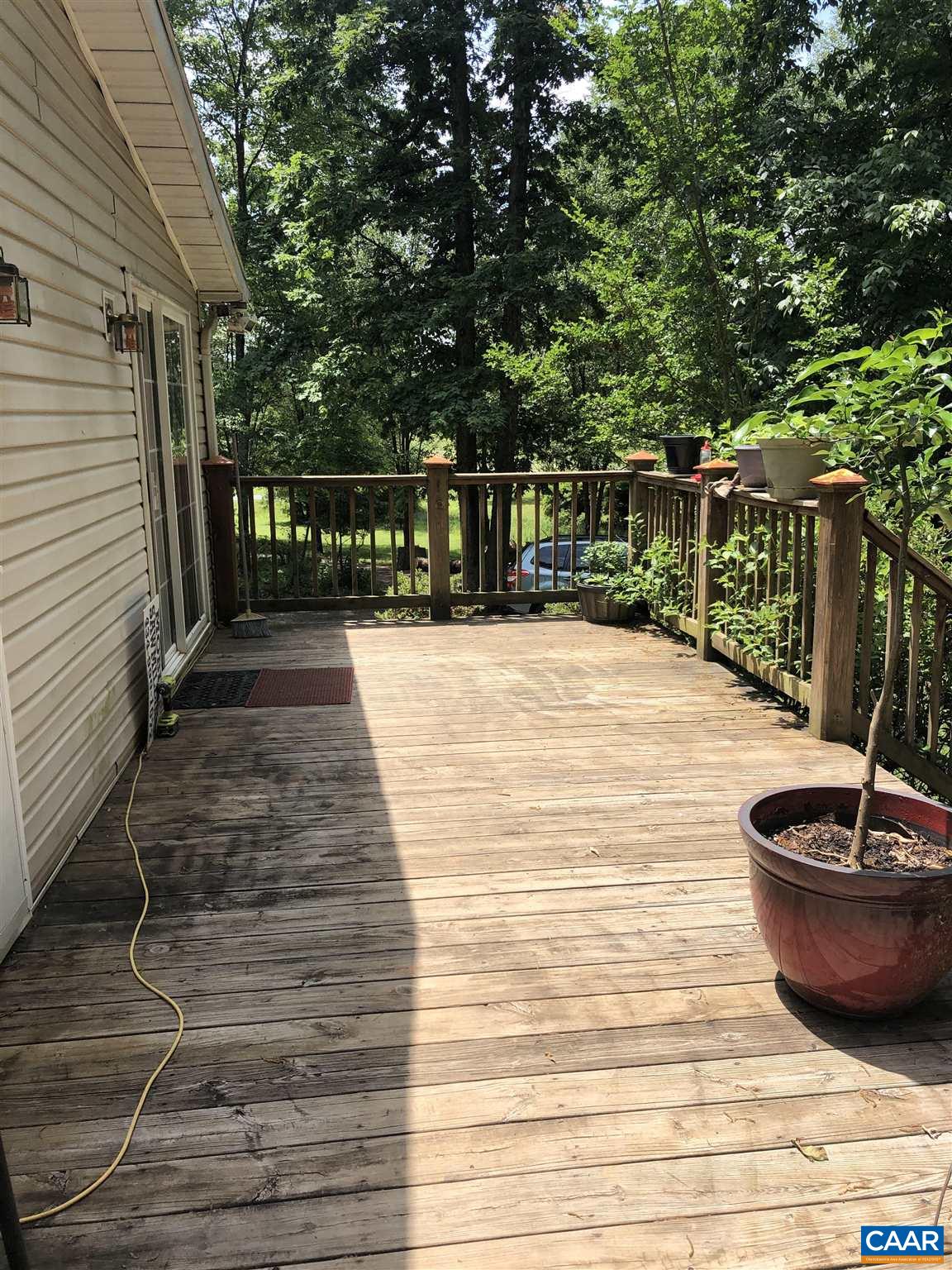 583 Rippin Run Road Ruckersville, VA 22968 - Photo 17 of 28 a view of a backyard with plants and trees
