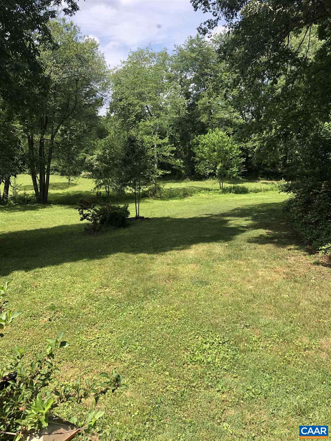 583 Rippin Run Road Ruckersville, VA 22968 - Photo 20 of 28 a view of a golf course with a lake
