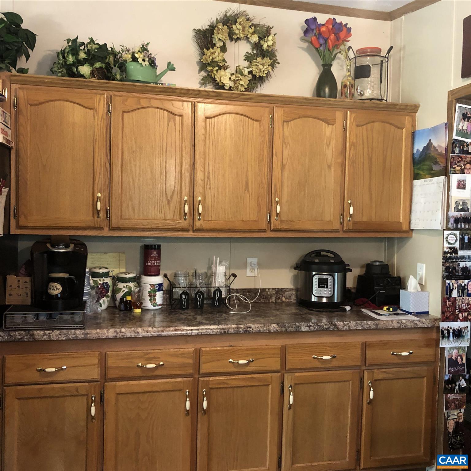 583 Rippin Run Road Ruckersville, VA 22968 - Photo 5 of 28 a kitchen with stainless steel appliances granite countertop a refrigerator and wooden cabinets