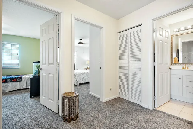 a bedroom with a bed and a desk