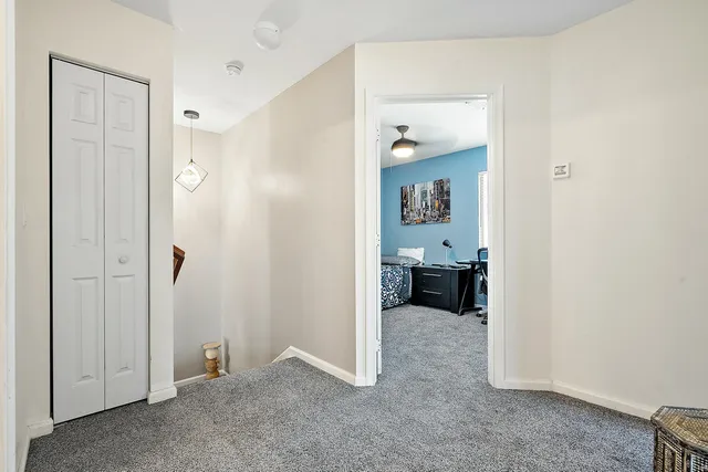 a view of a house with backyard sitting area and swimming pool