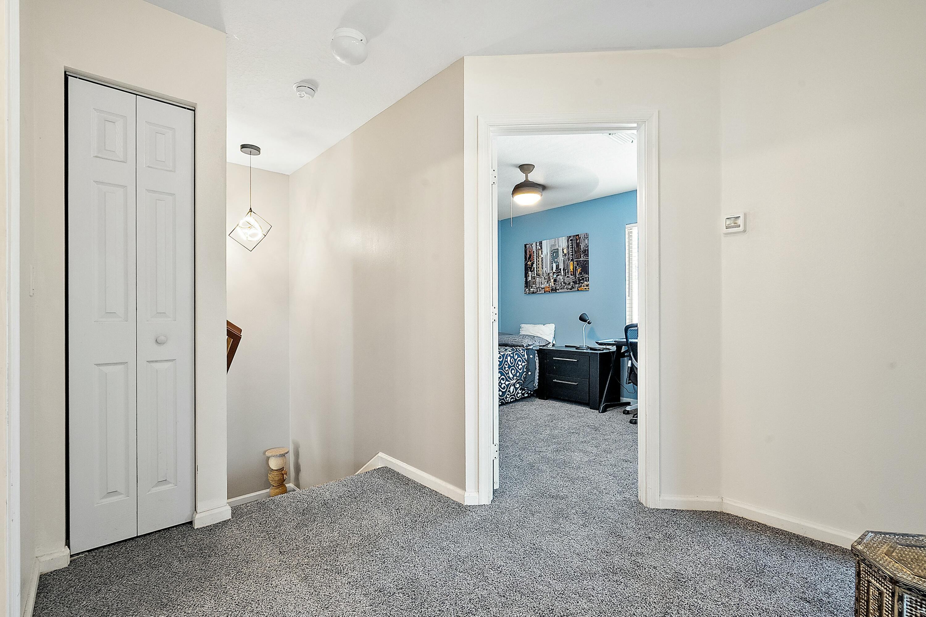 2480 Southeast Springtree Place Stuart, FL 34997 - Photo 28 of 39 a view of a hallway with livingroom and furniture