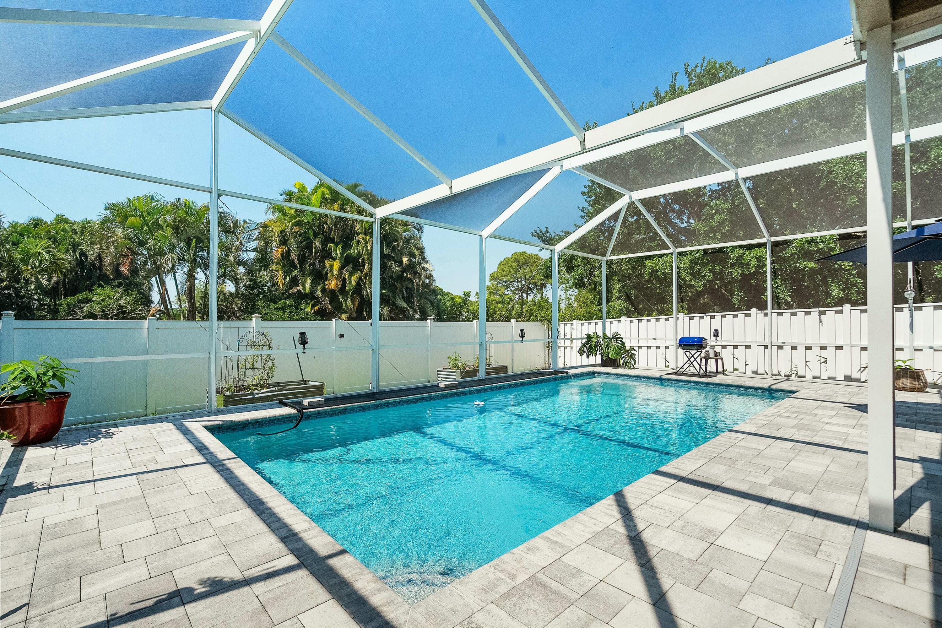 2480 Southeast Springtree Place Stuart, FL 34997 - Photo 30 of 39 a view of a backyard with sitting area