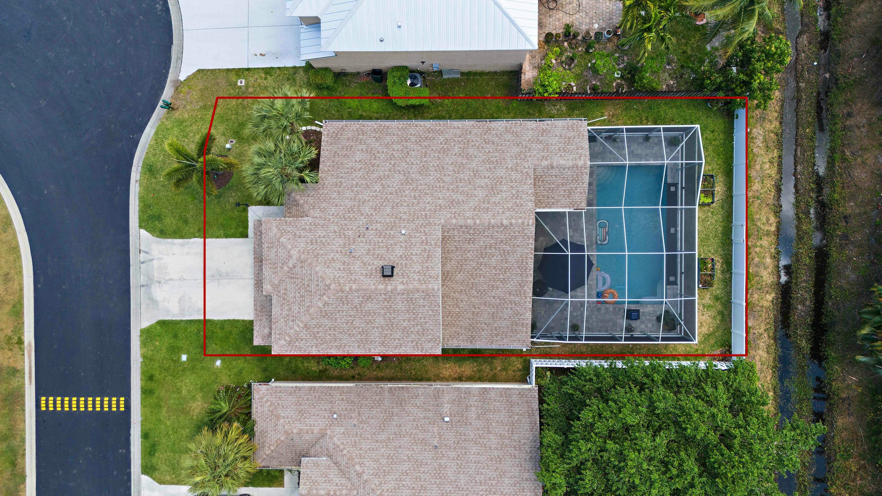 2480 Southeast Springtree Place Stuart, FL 34997 - Photo 36 of 39 an aerial view of a house with a yard