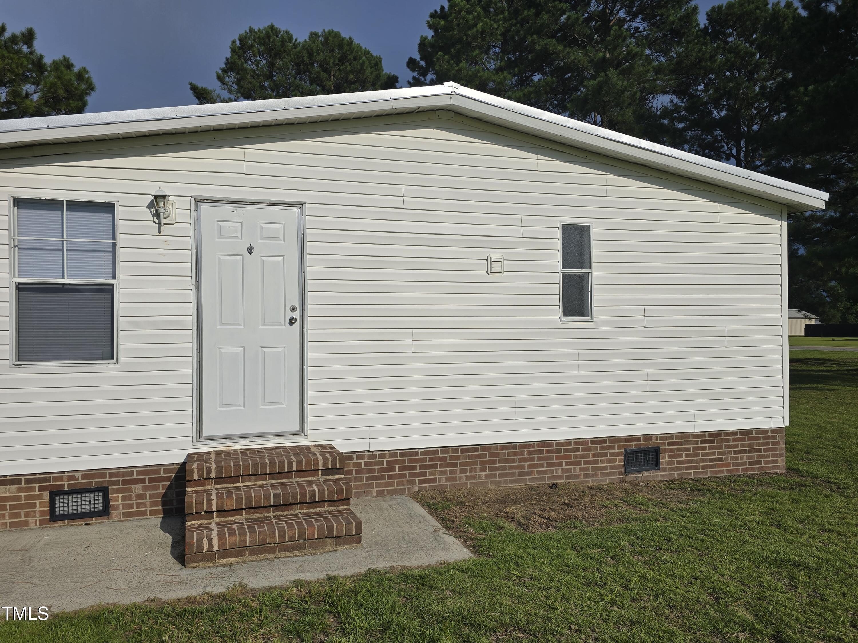 Door on end of house from garage