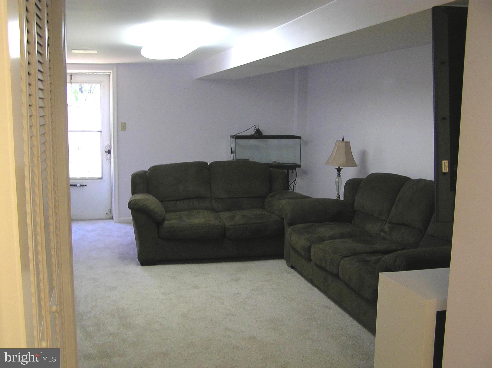 812 Medway Road Philadelphia, PA 19115 - Photo 22 of 33 a living room with furniture and a window