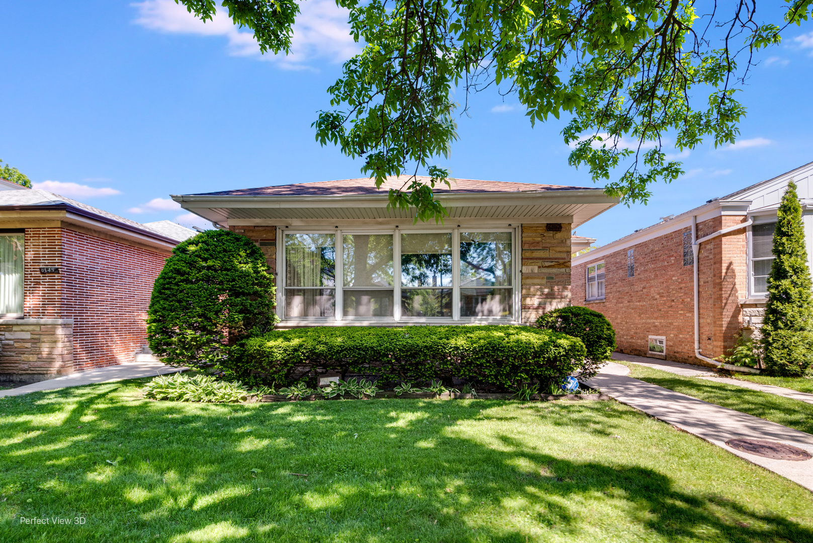 6147 North Harding Avenue Chicago, IL 60659 - Photo 2 of 10 a front view of a house with garden