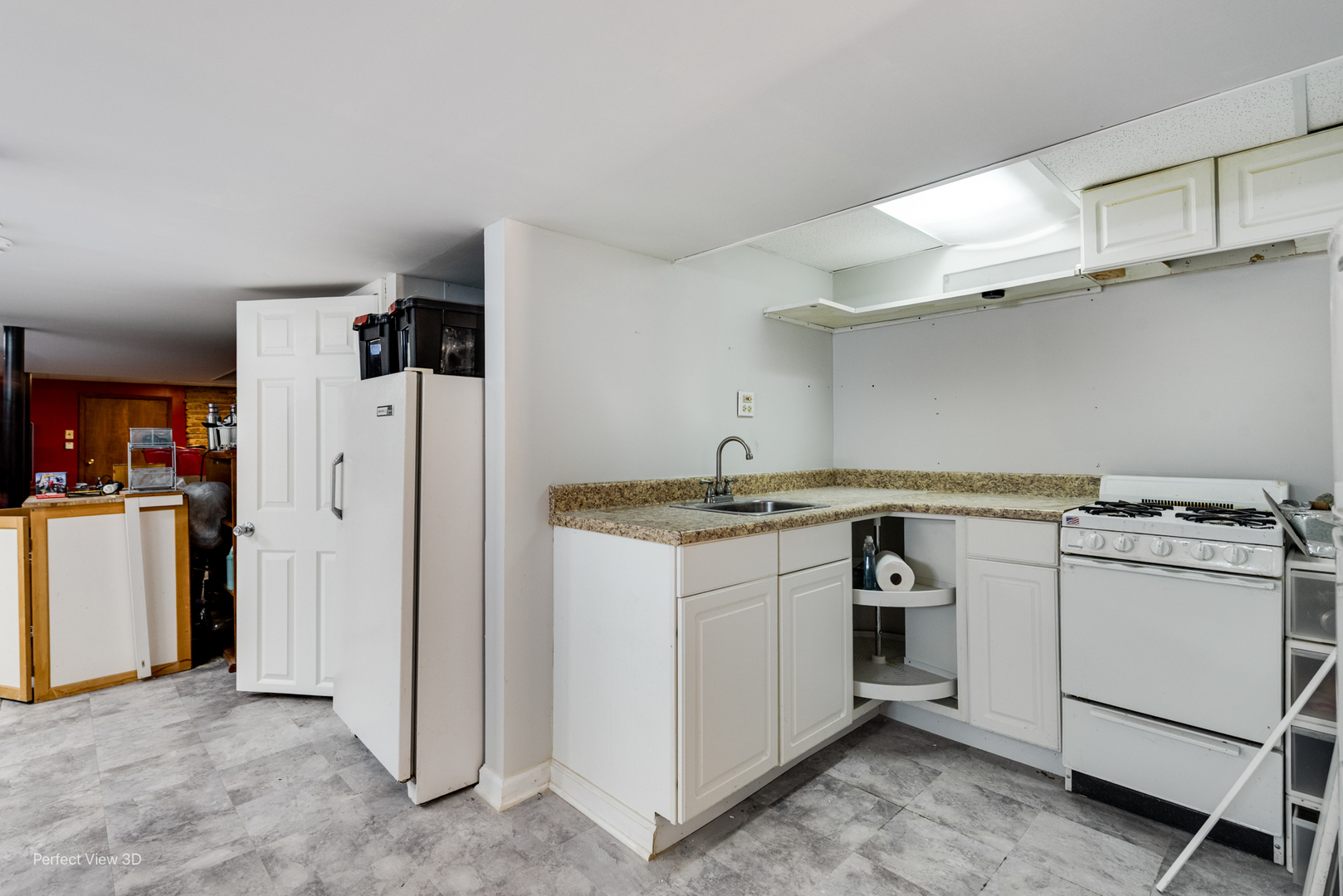 6147 North Harding Avenue Chicago, IL 60659 - Photo 7 of 10 a kitchen with white cabinets and white appliances