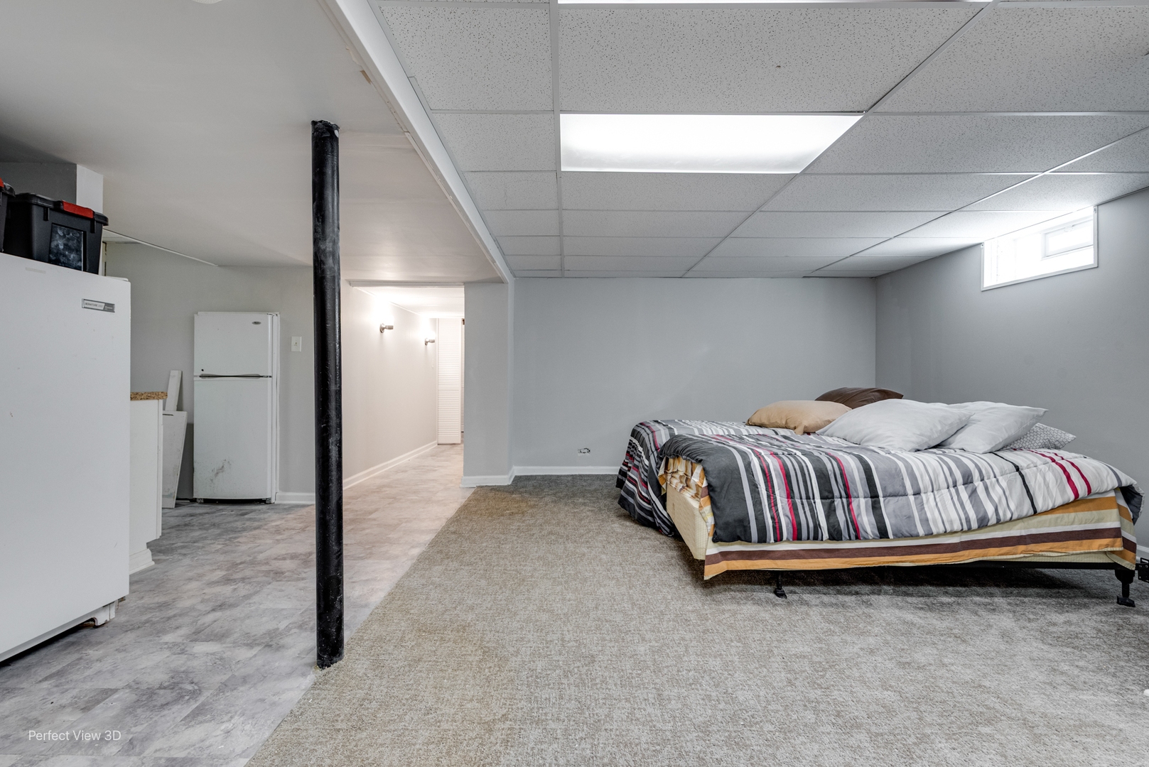 6147 North Harding Avenue Chicago, IL 60659 - Photo 8 of 10 a bedroom with a bed and a refrigerator