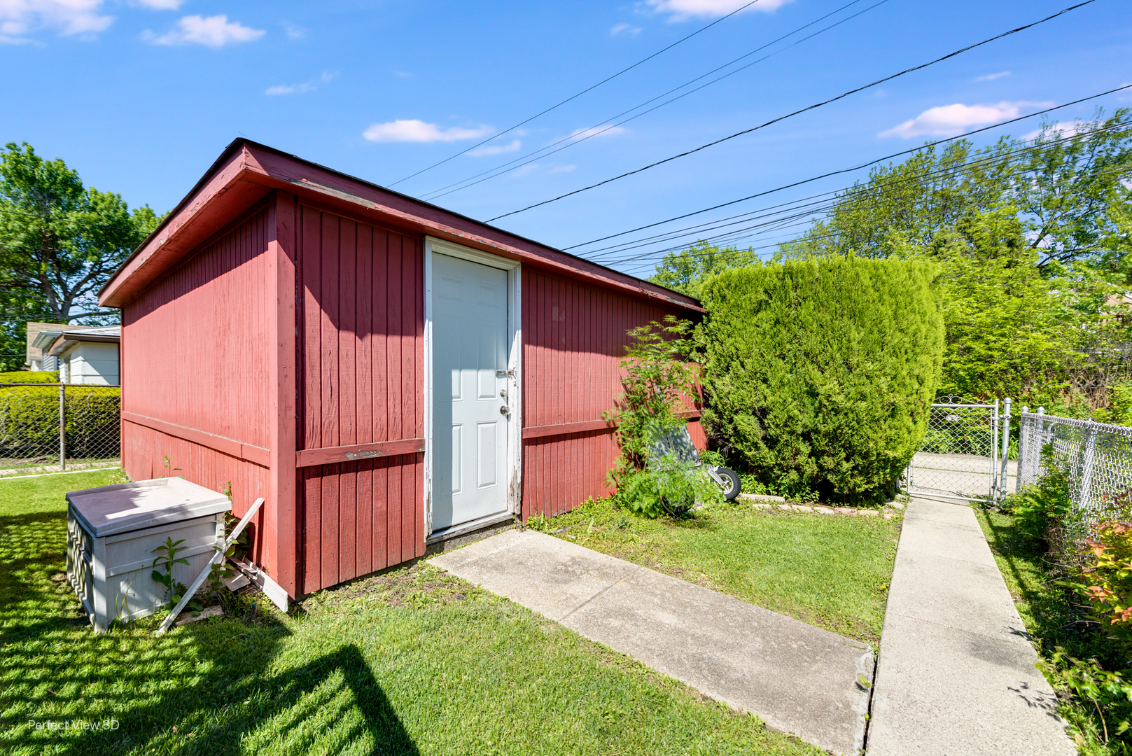 6147 North Harding Avenue Chicago, IL 60659 - Photo 10 of 10 a view of backyard with potted plants and a wooden fence