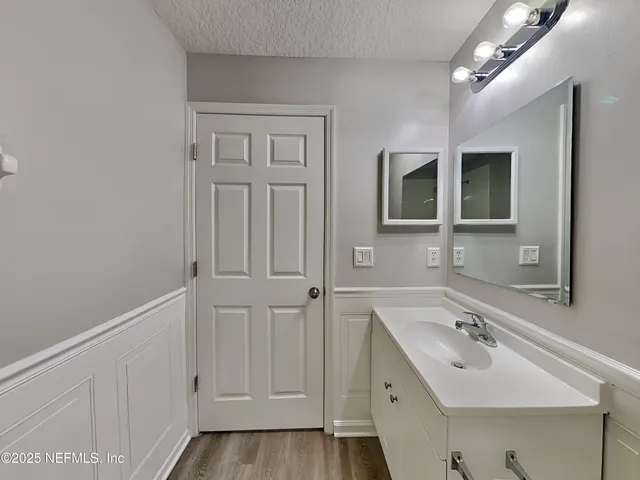 a bathroom with a sink and mirror