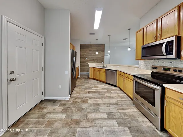 a large kitchen with cabinets
