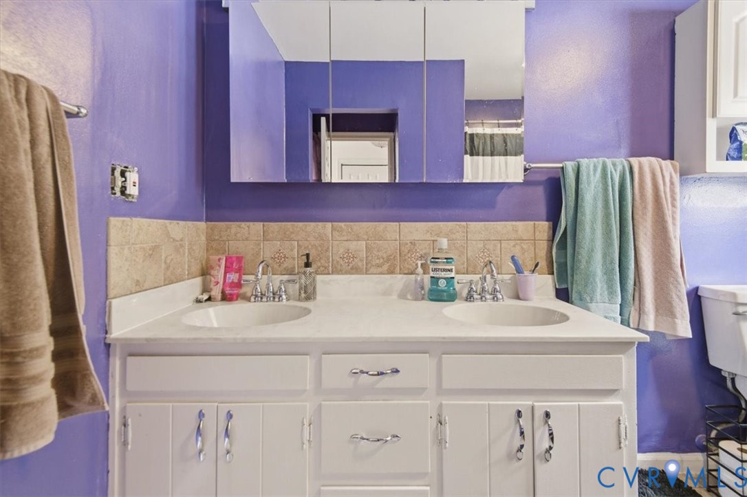 4508 Ridgecrest Lane Colonial Heights, VA 23834 - Photo 29 of 52 Dual sink vanity featuring a white countertop with