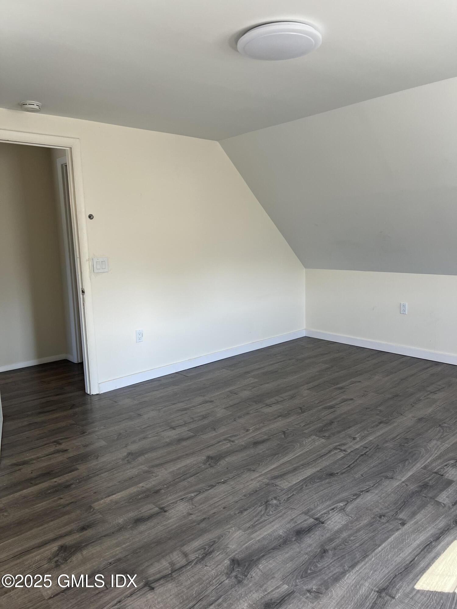 71 Byram Road, Unit 2 Greenwich, CT 06830 - Photo 8 of 10 a view of empty room with wooden floor