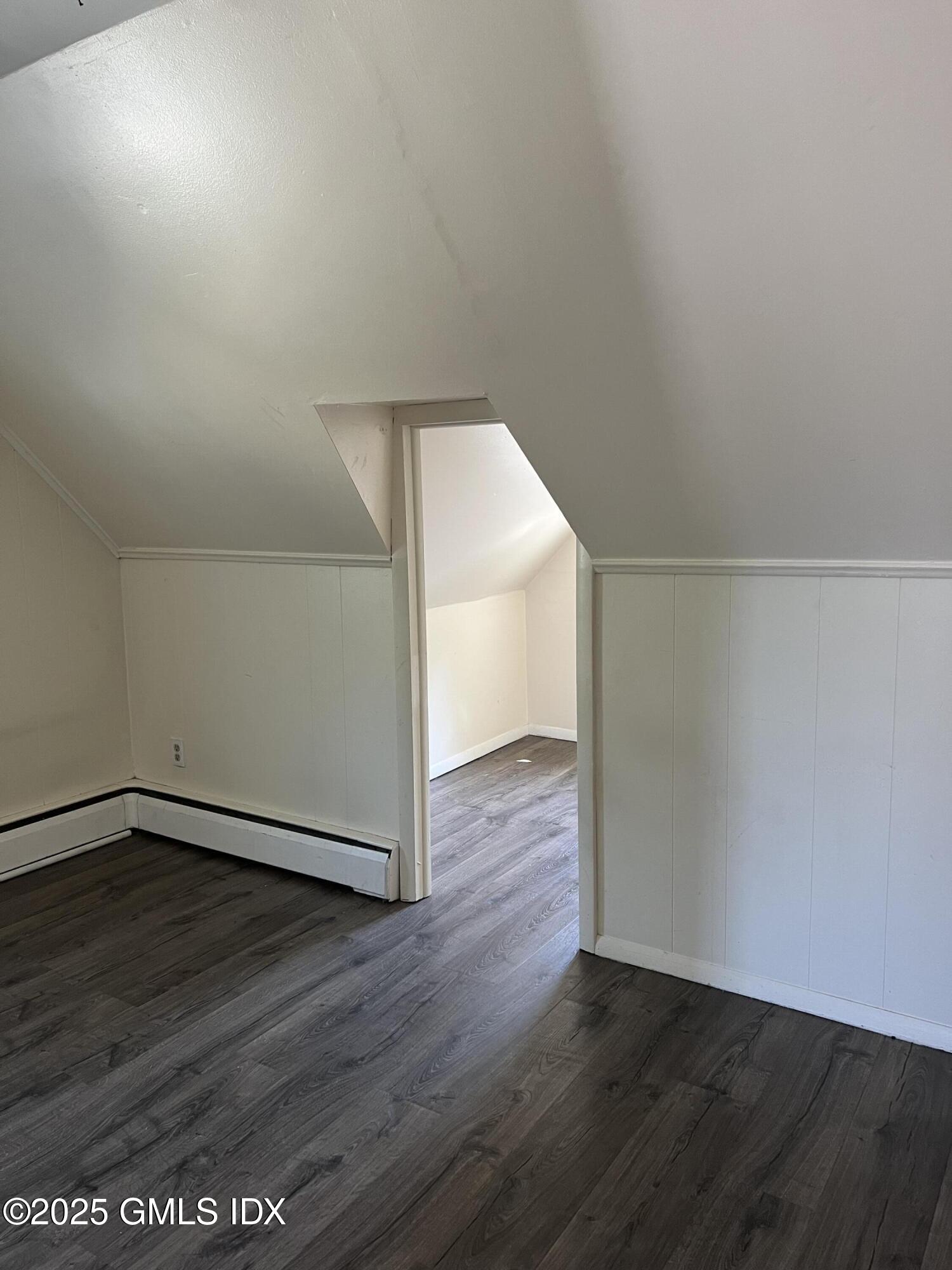 71 Byram Road, Unit 2 Greenwich, CT 06830 - Photo 9 of 10 a view of an empty room with wooden floor