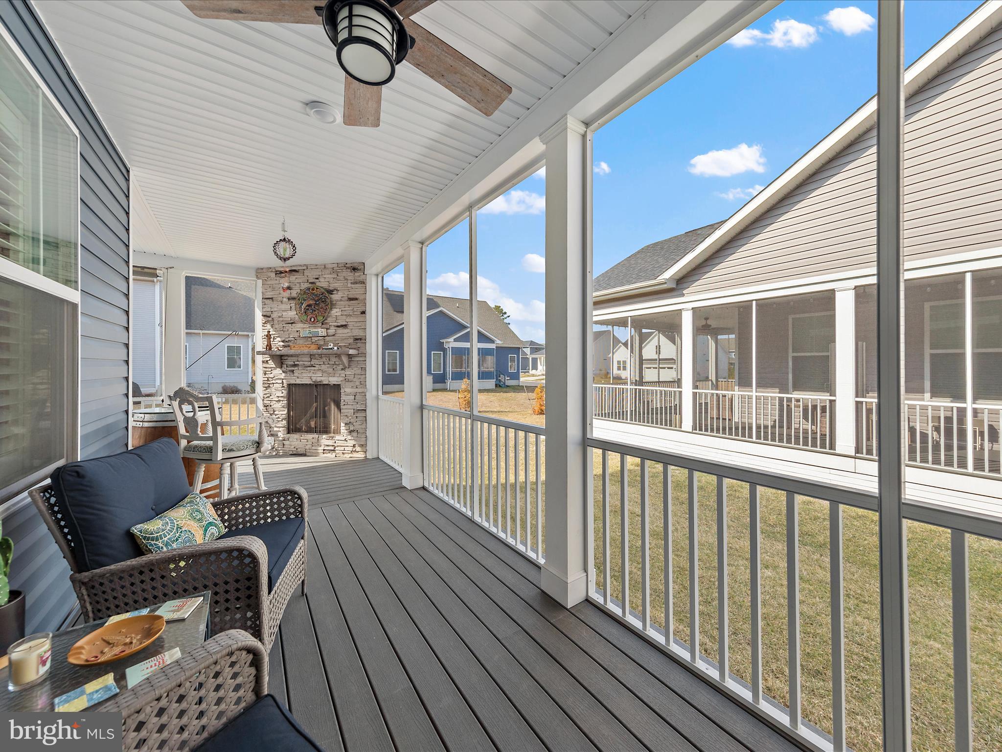 18554 Emerson Way Georgetown, DE 19947 - Photo 25 of 42 a living room with furniture and a floor to ceiling window