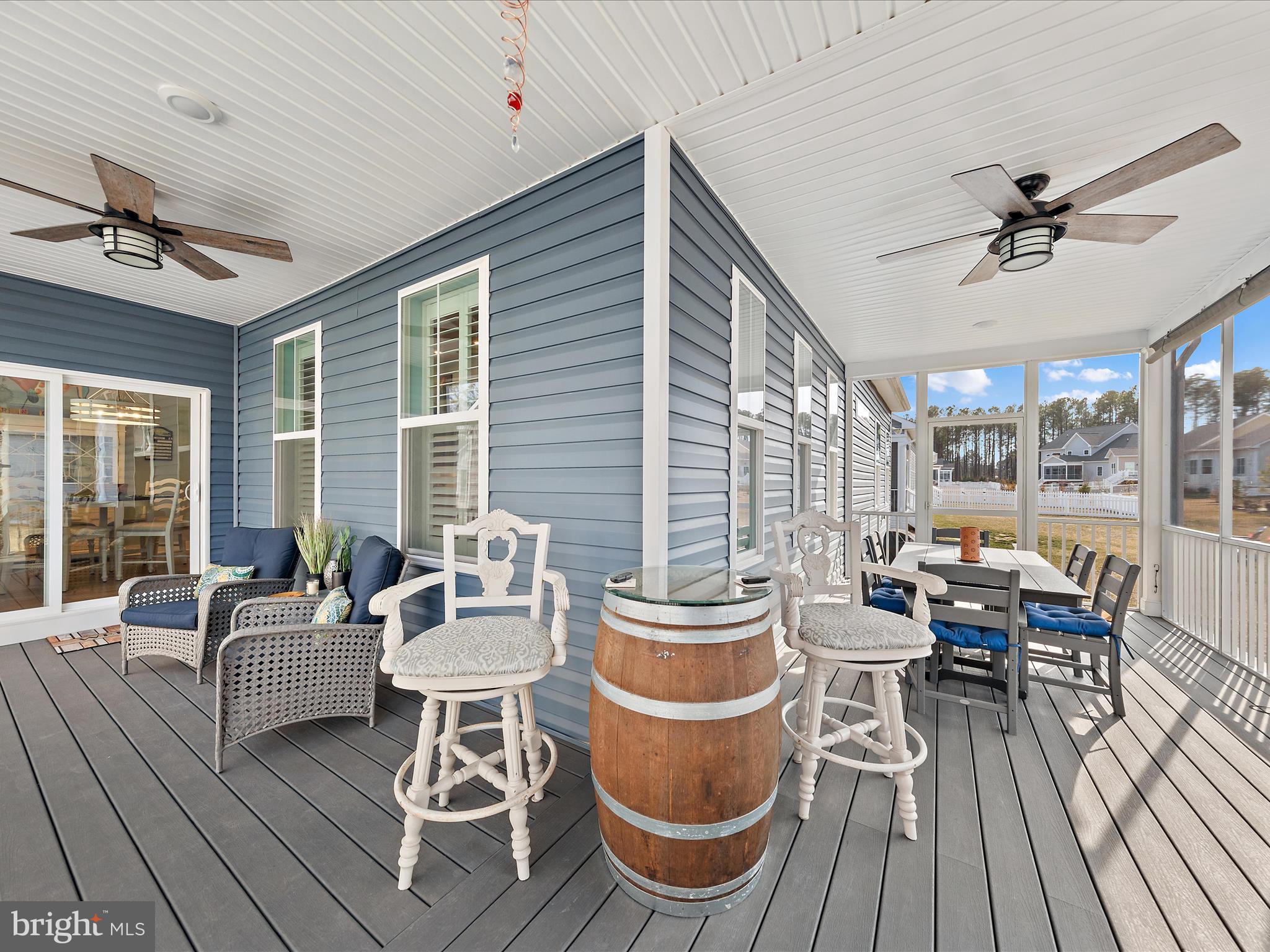 18554 Emerson Way Georgetown, DE 19947 - Photo 26 of 42 a dining room with furniture a chandelier and wooden floor