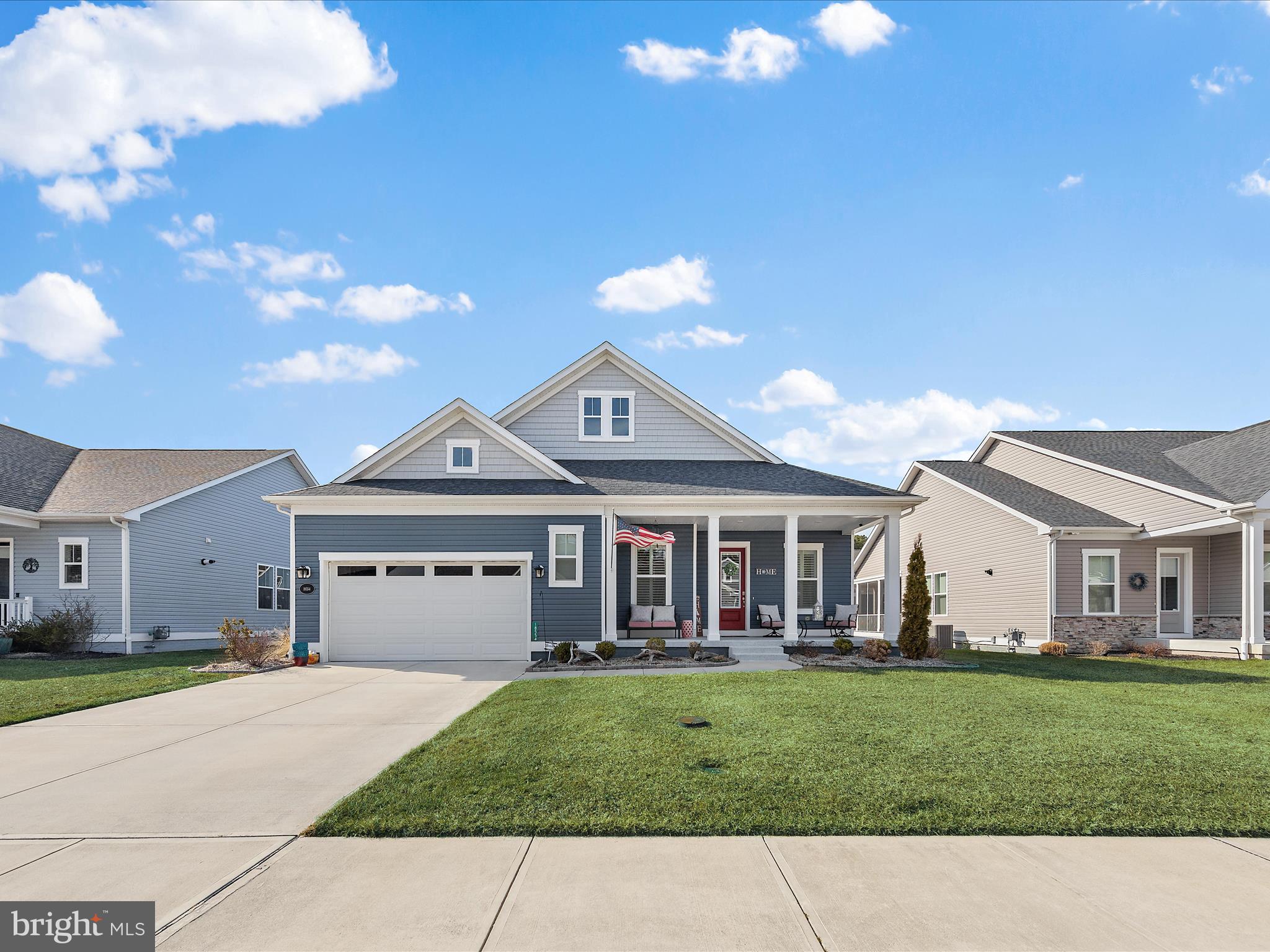18554 Emerson Way Georgetown, DE 19947 - Photo 33 of 42 a view of a white house with a big yard and large trees