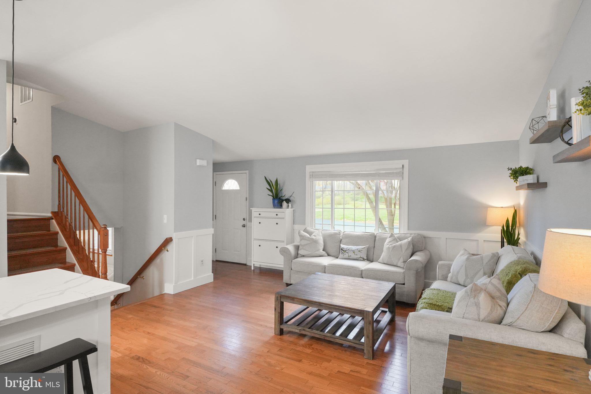 8282 Morning Dew Court Springfield, VA 22153 - Photo 14 of 63 a living room with furniture and a wooden floor