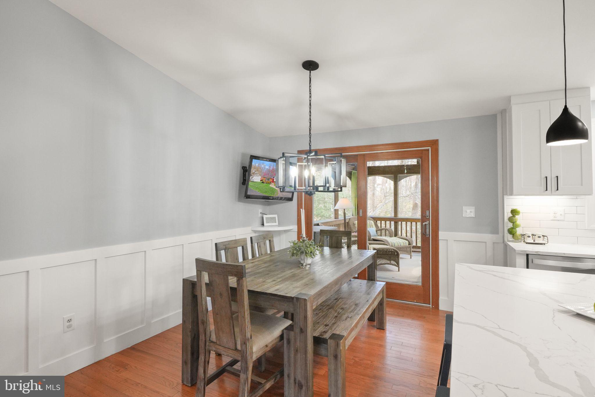 8282 Morning Dew Court Springfield, VA 22153 - Photo 20 of 63 a view of a dining room with furniture window and wooden floor