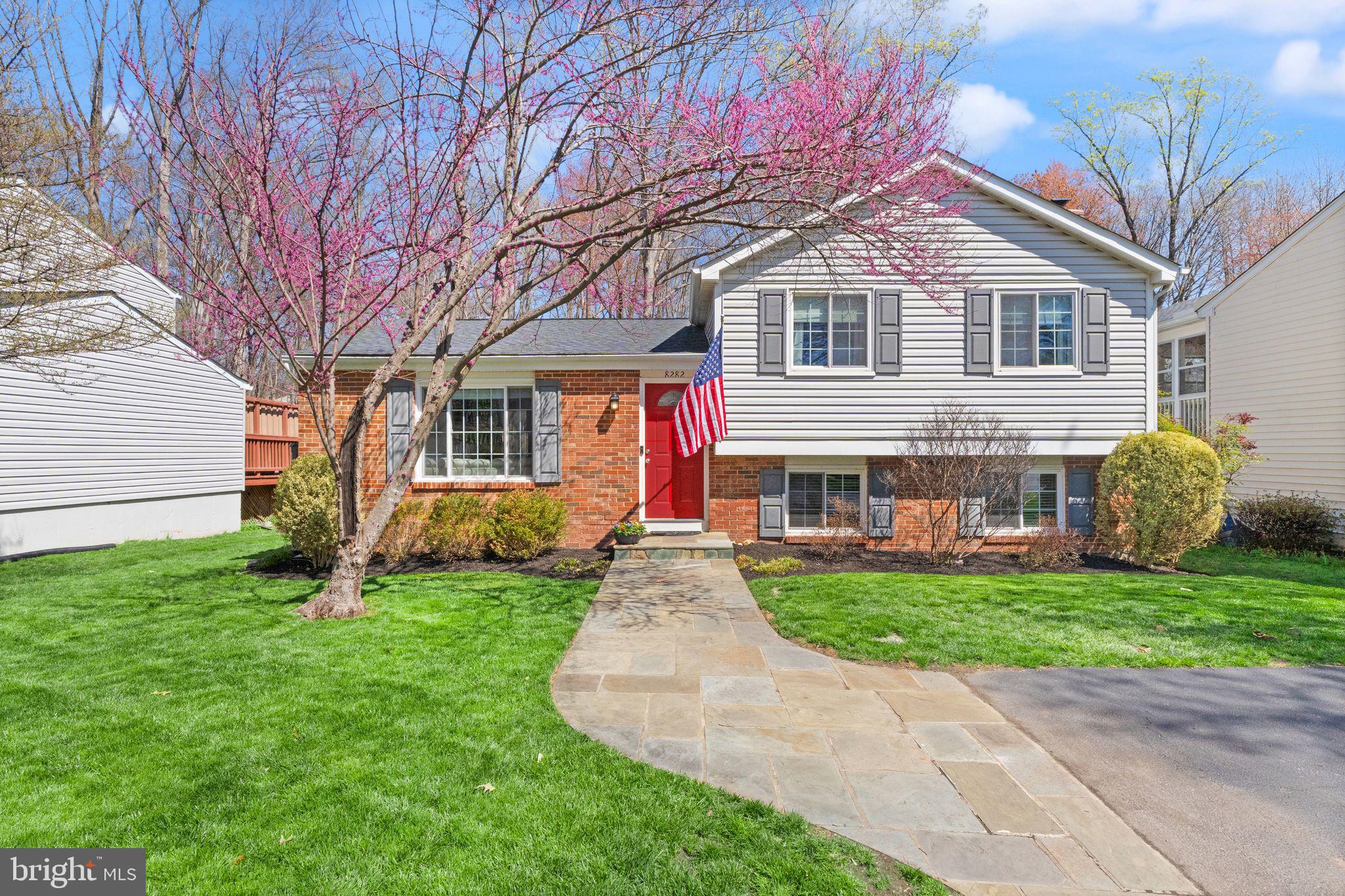8282 Morning Dew Court Springfield, VA 22153 - Photo 2 of 63 a front view of a house with garden