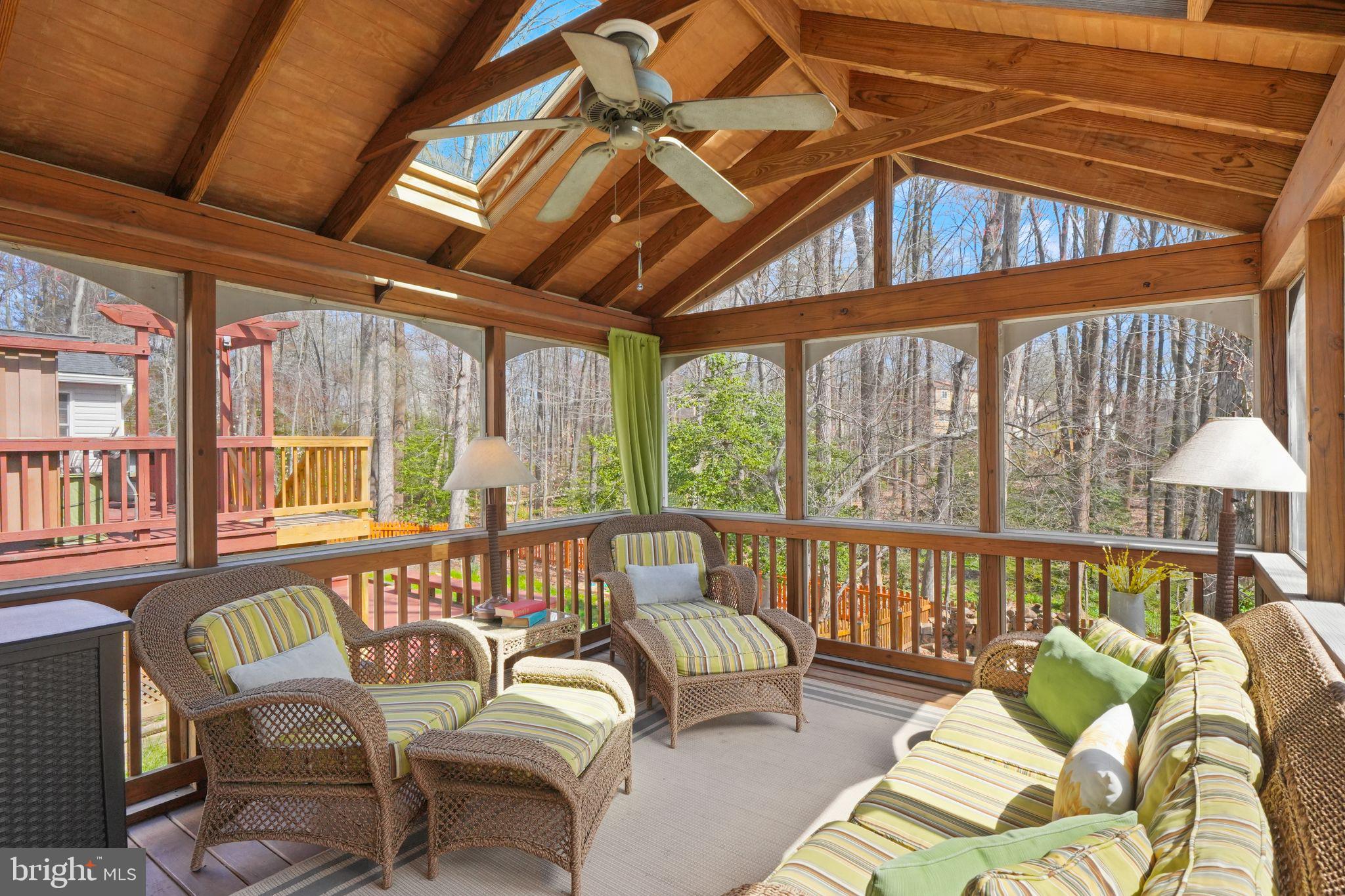 8282 Morning Dew Court Springfield, VA 22153 - Photo 21 of 63 a view of a patio with couches chairs and wooden floor