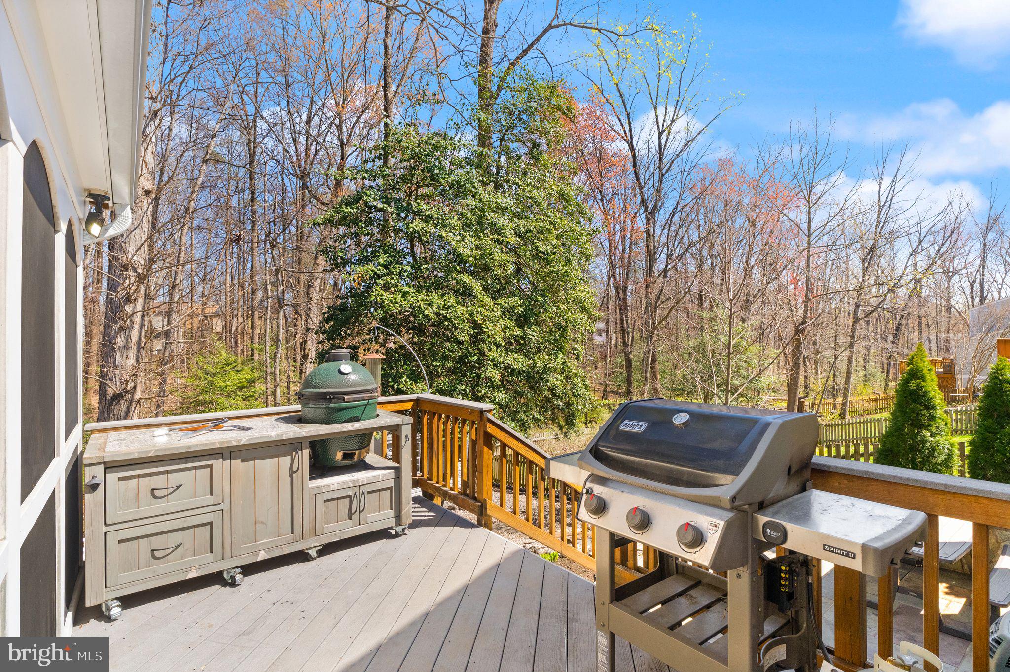 8282 Morning Dew Court Springfield, VA 22153 - Photo 45 of 63 a view of a chairs and table on the wooden deck