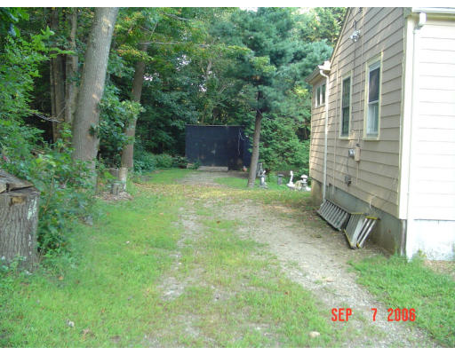 62 Prescott Road Concord, MA 01742 - Photo 22 of 25 a pathway of a house with a yard