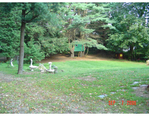 62 Prescott Road Concord, MA 01742 - Photo 24 of 25 a view of a garden with a bench