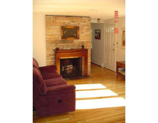 62 Prescott Road Concord, MA 01742 - Photo 9 of 25 a living room with furniture and a fireplace