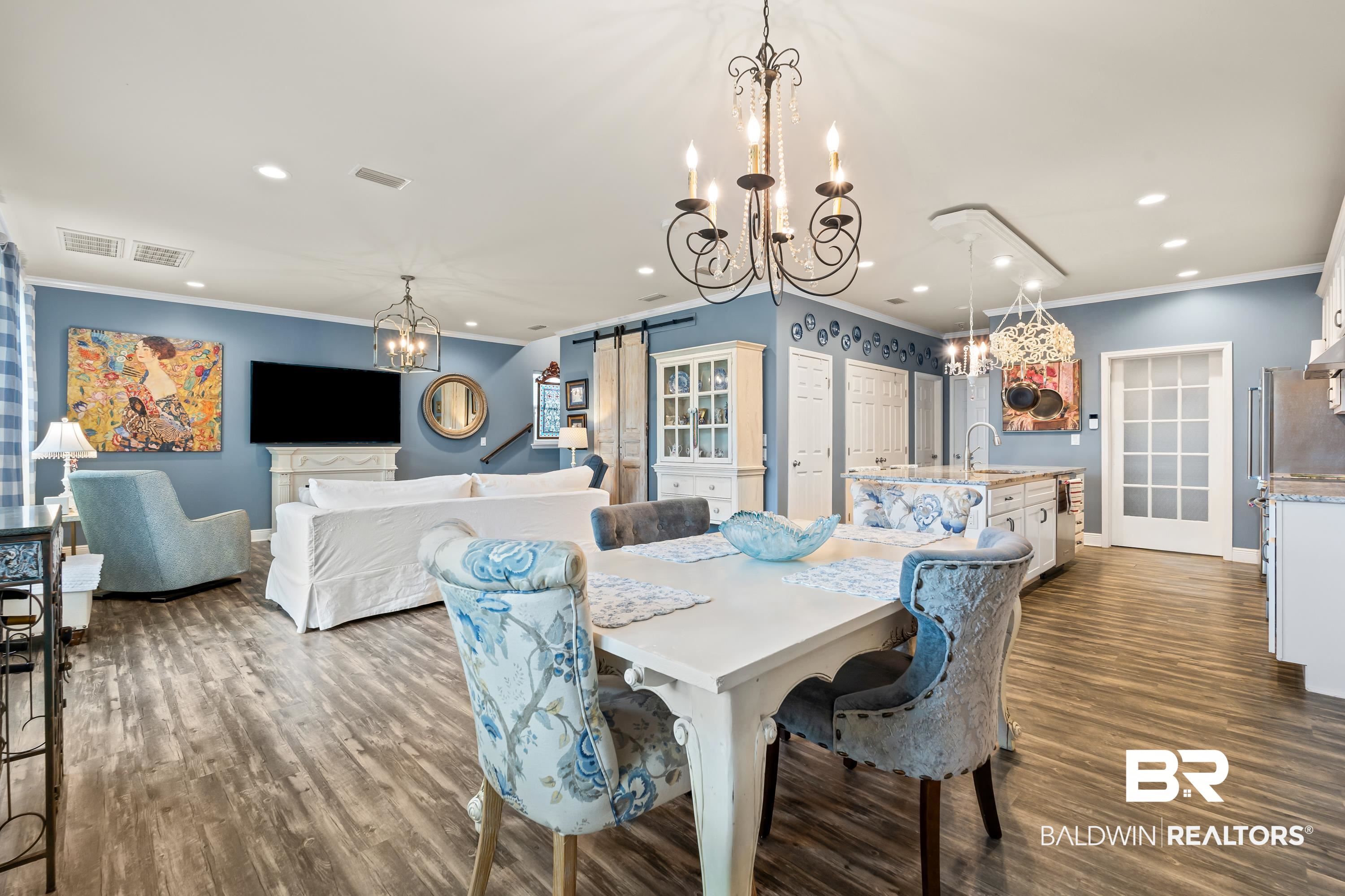 1113 Yellow Daisy Lane Foley, AL 36535 - Photo 11 of 35 Dining area with crown molding, recessed lighting, a barn door, dark wood-style floors, and a chandelier