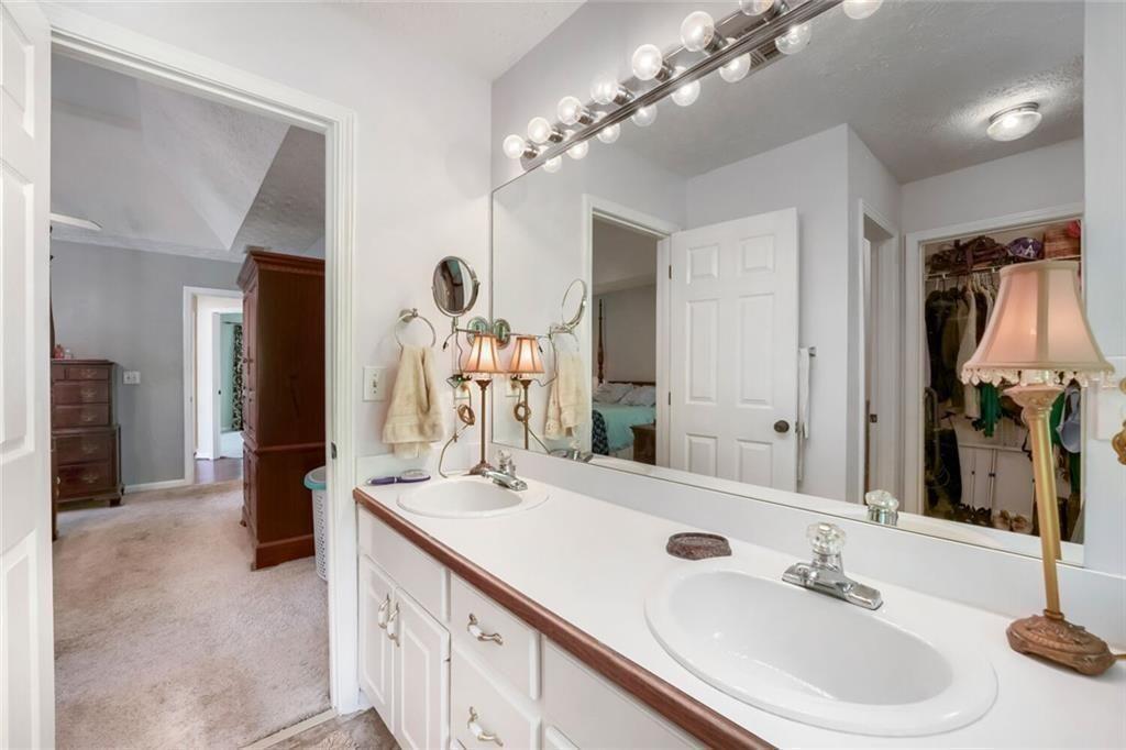 2128 Cluster Lane Grayson, GA 30017 - Photo 15 of 40 a bathroom with a sink double vanity and a mirror